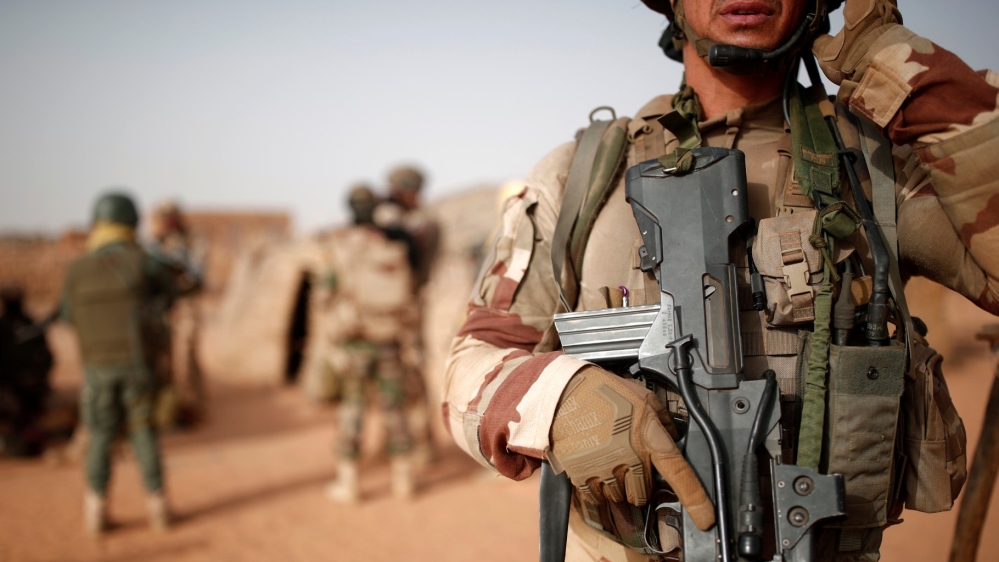 Malian troops and French soldiers during a 2017 joint patrol in Inaloglog