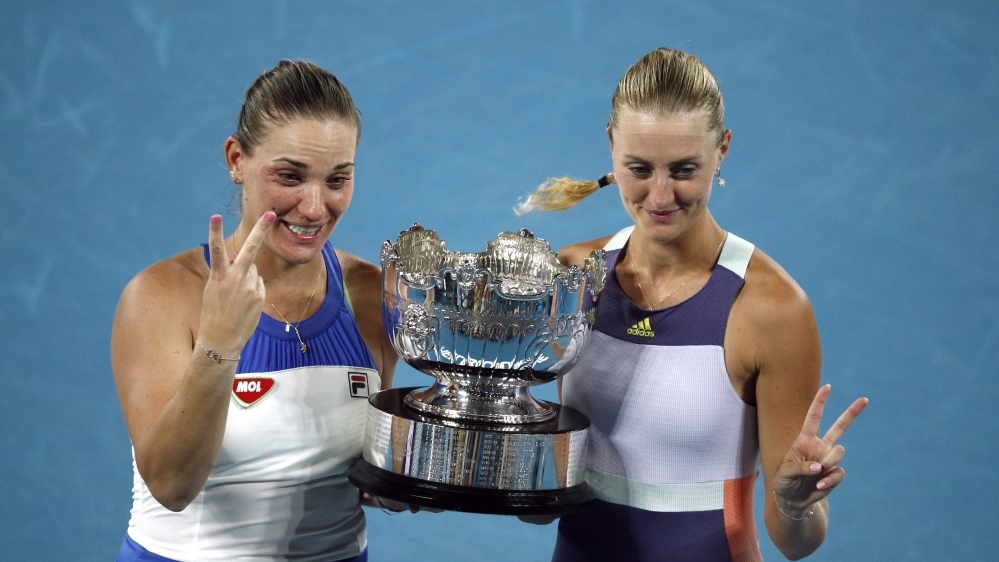 Hungary’s Timea Babos and France’s Kristina Mladenovic celebrate with the trophy after winning the final against Taiwan’s Su-wei Hsieh and Czech Republic’s Barbora Strycova