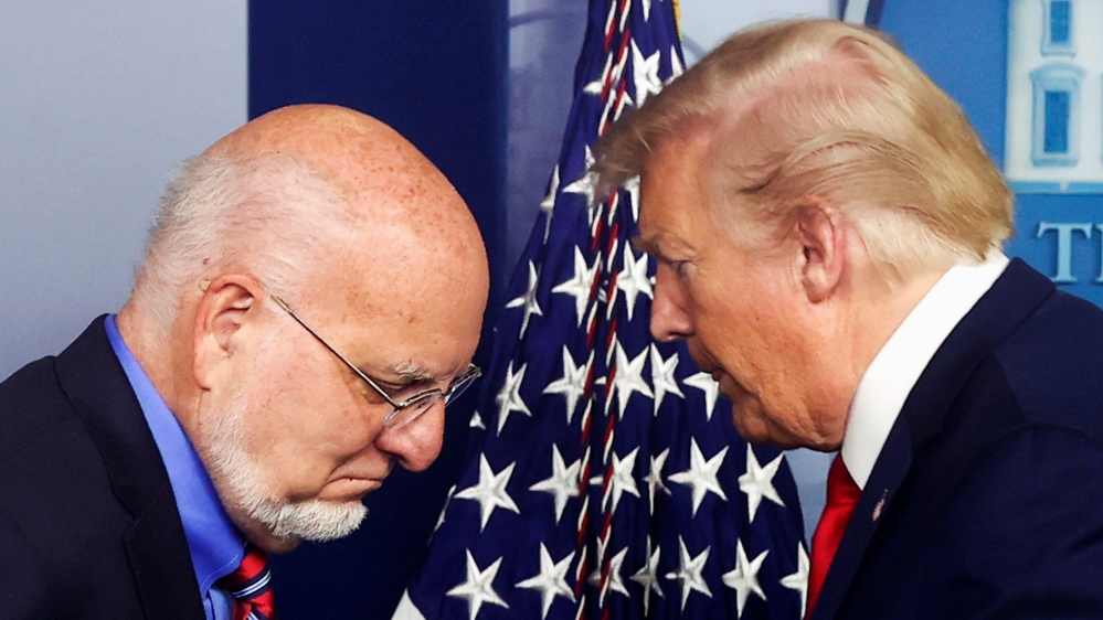 US President Donald Trump gives the podium to CDC Director Robert Redfield to address the daily coronavirus disease (COVID-19) outbreak task force briefing at the White House in April 2020