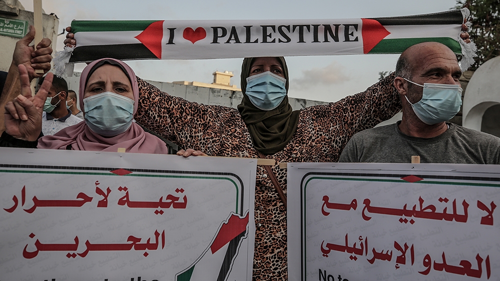 Palestinians in Gaza City attend a protest against the agreement between Israel and the UAE and Bahrain