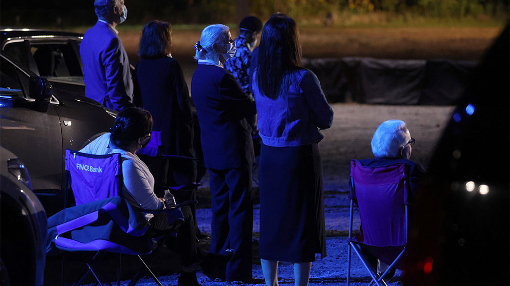 People gather to listen to Democratic US presidential nominee Joe Biden speak during a televised, drive-in town hall in Scranton, Pennsylvania,