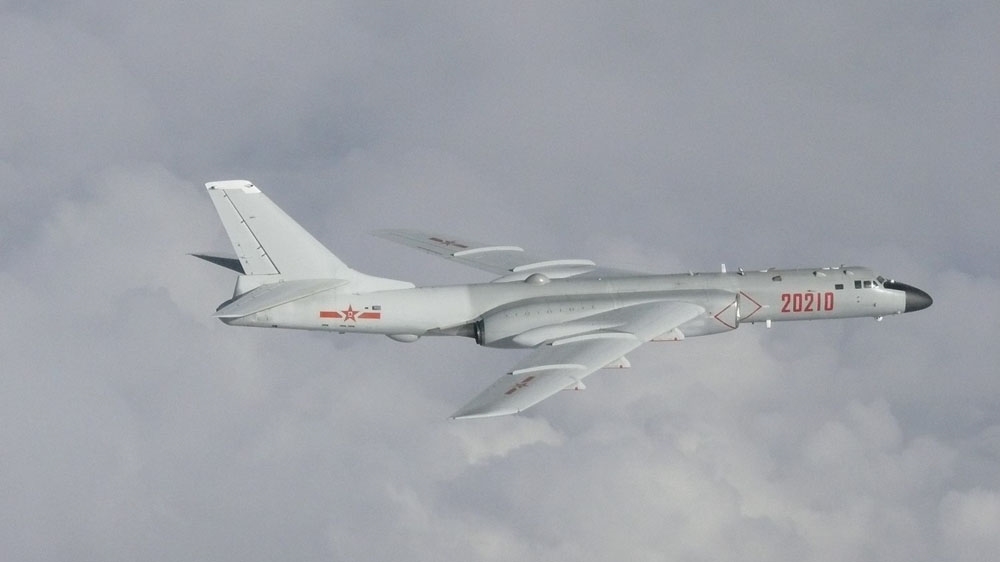 China H-6 bomber flying in the clouds over the East China Sea.