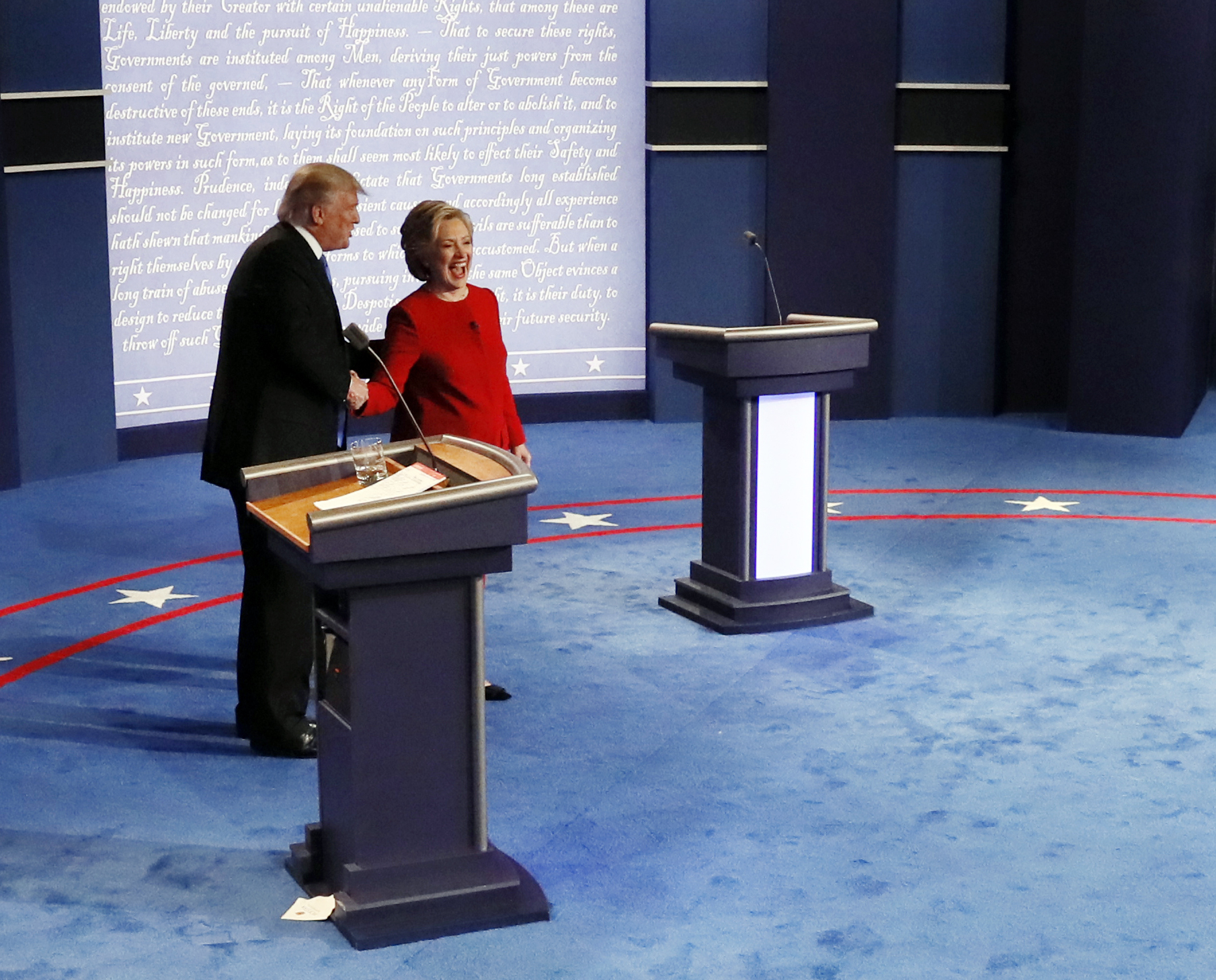 Republican presidential nominee Donald Trump and Democratic presidential nominee Hillary Clinton shake hands after the first presidential debate, September 26, 2016