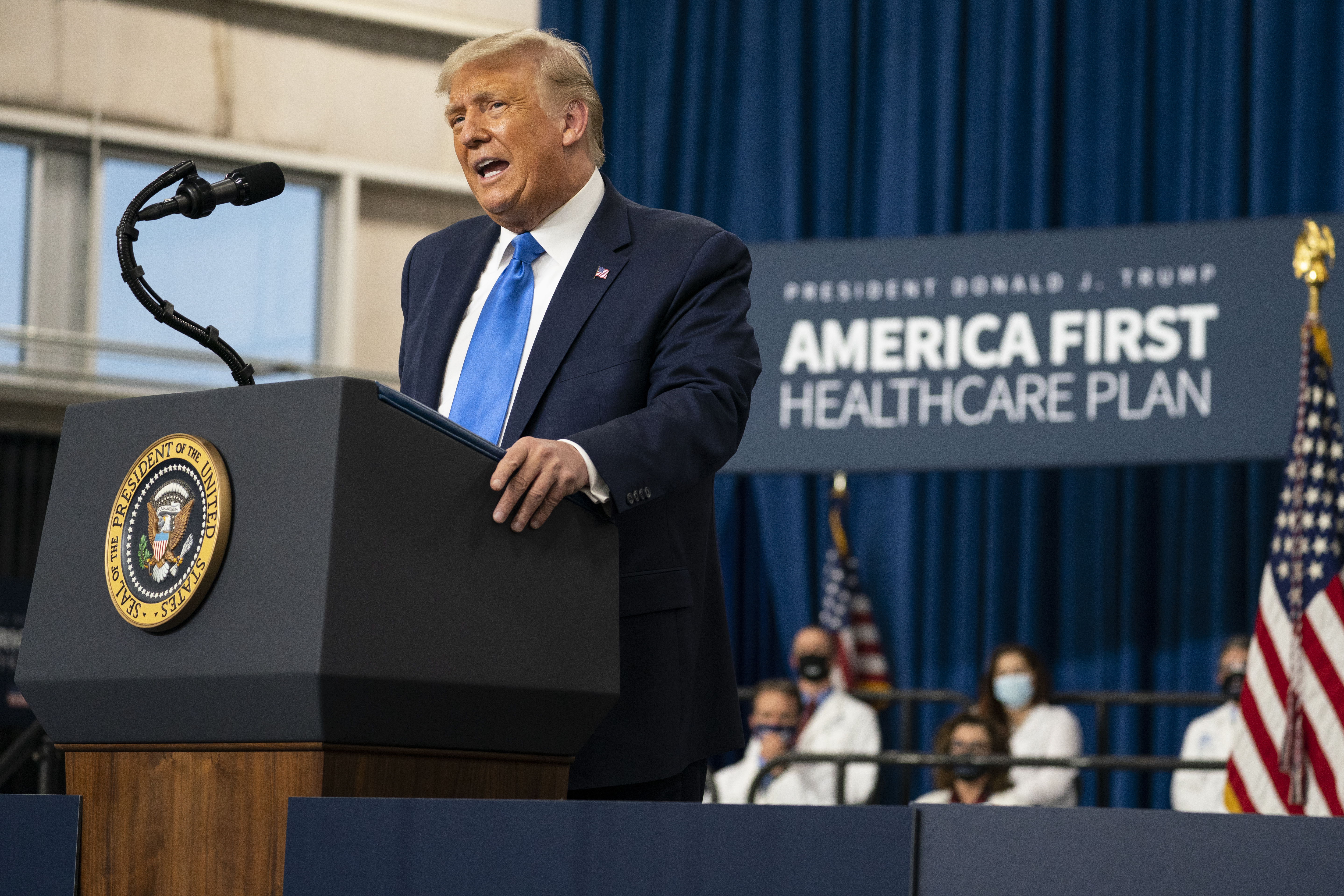 President Donald Trump delivers remarks on health care at Charlotte Douglas International Airport in Charlotte, North Carolina. [Evan Vucci/AP Photo)