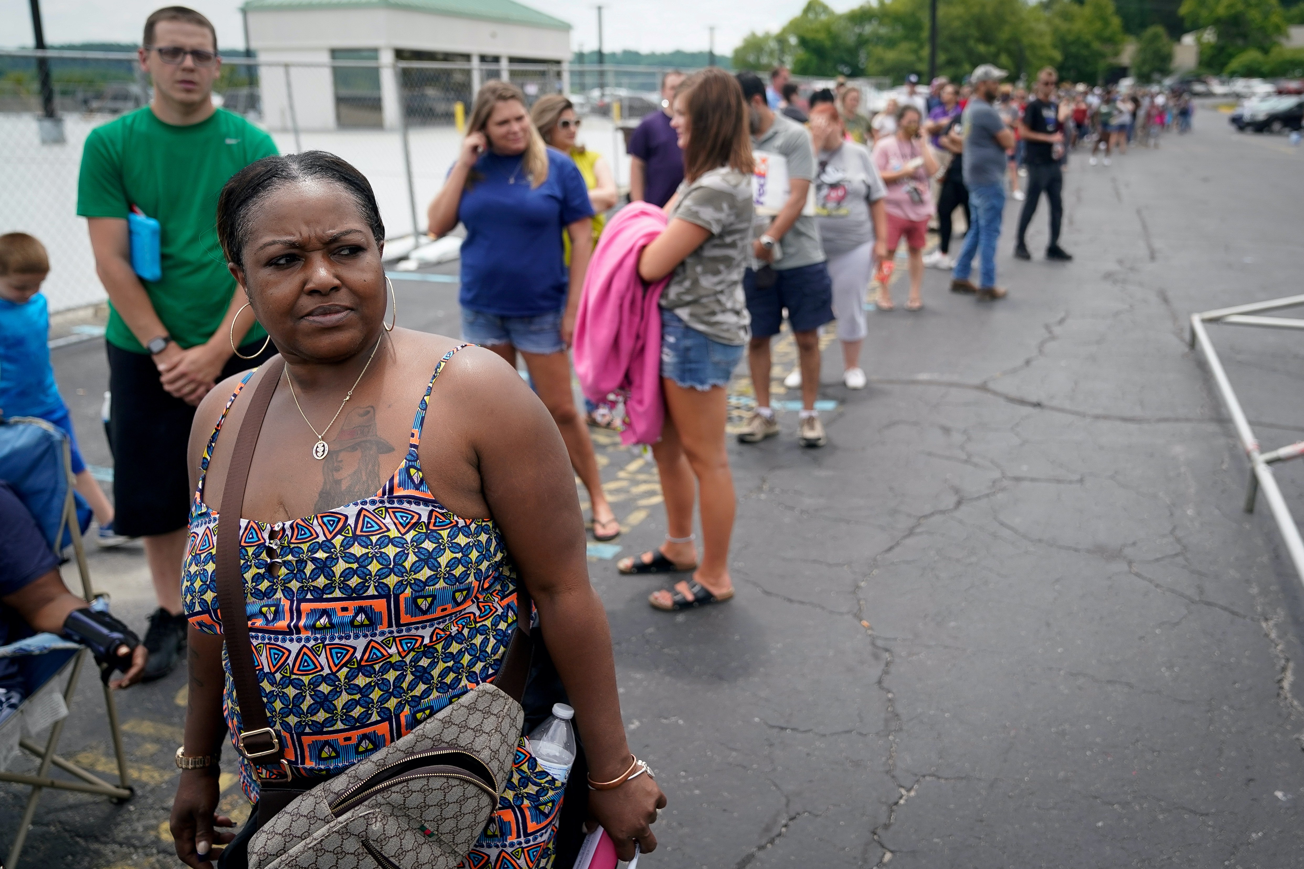 People wait in a line outside a temporary unemployment office established by the Kentucky Labor Cabinet at the State Capitol Annex in Frankfort, Kentucky, United States