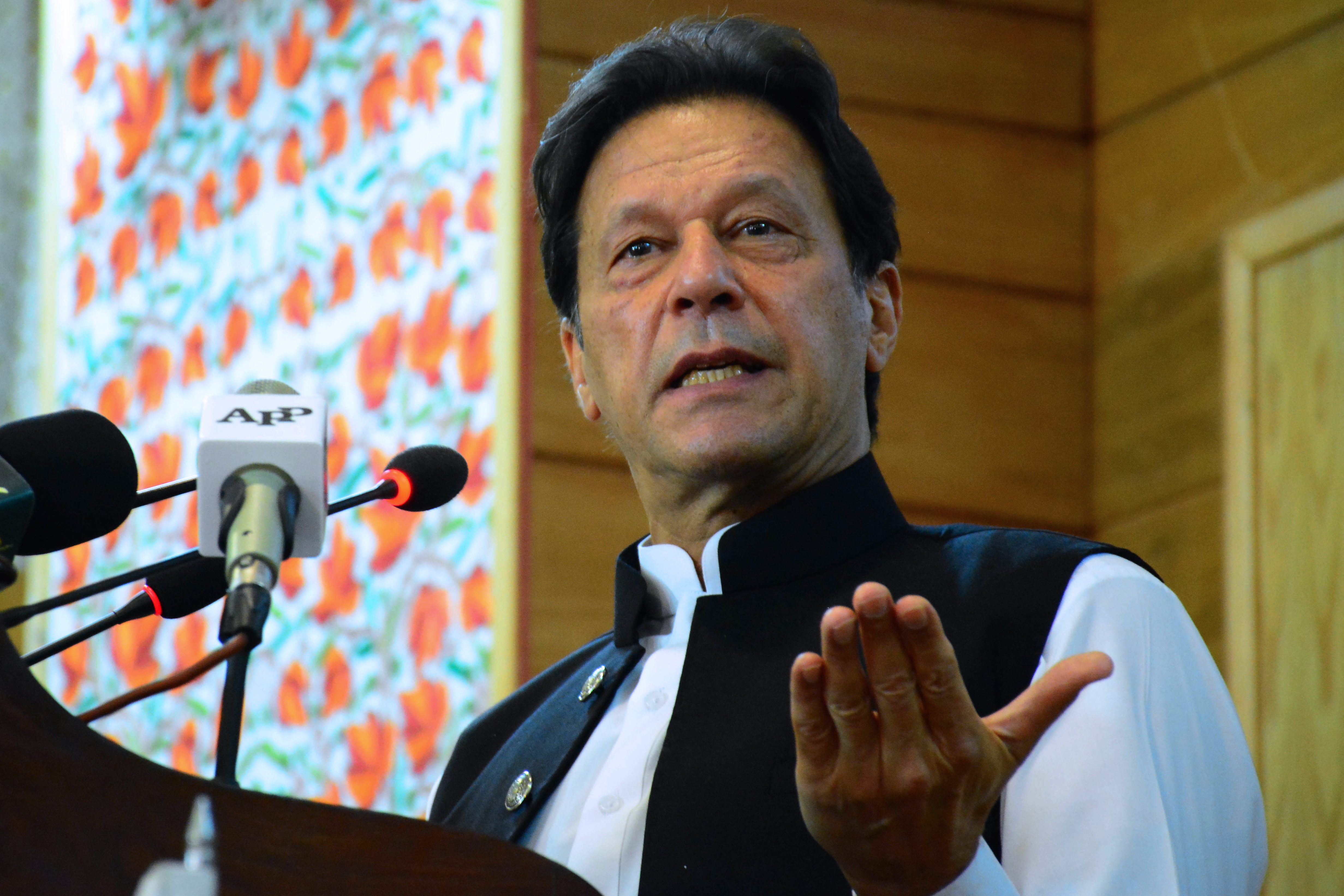 Imran Khan’s pronouncement was met with a sharp rebuke from India’s foreign ministry, which said it “firmly rejects” the move [AFP]