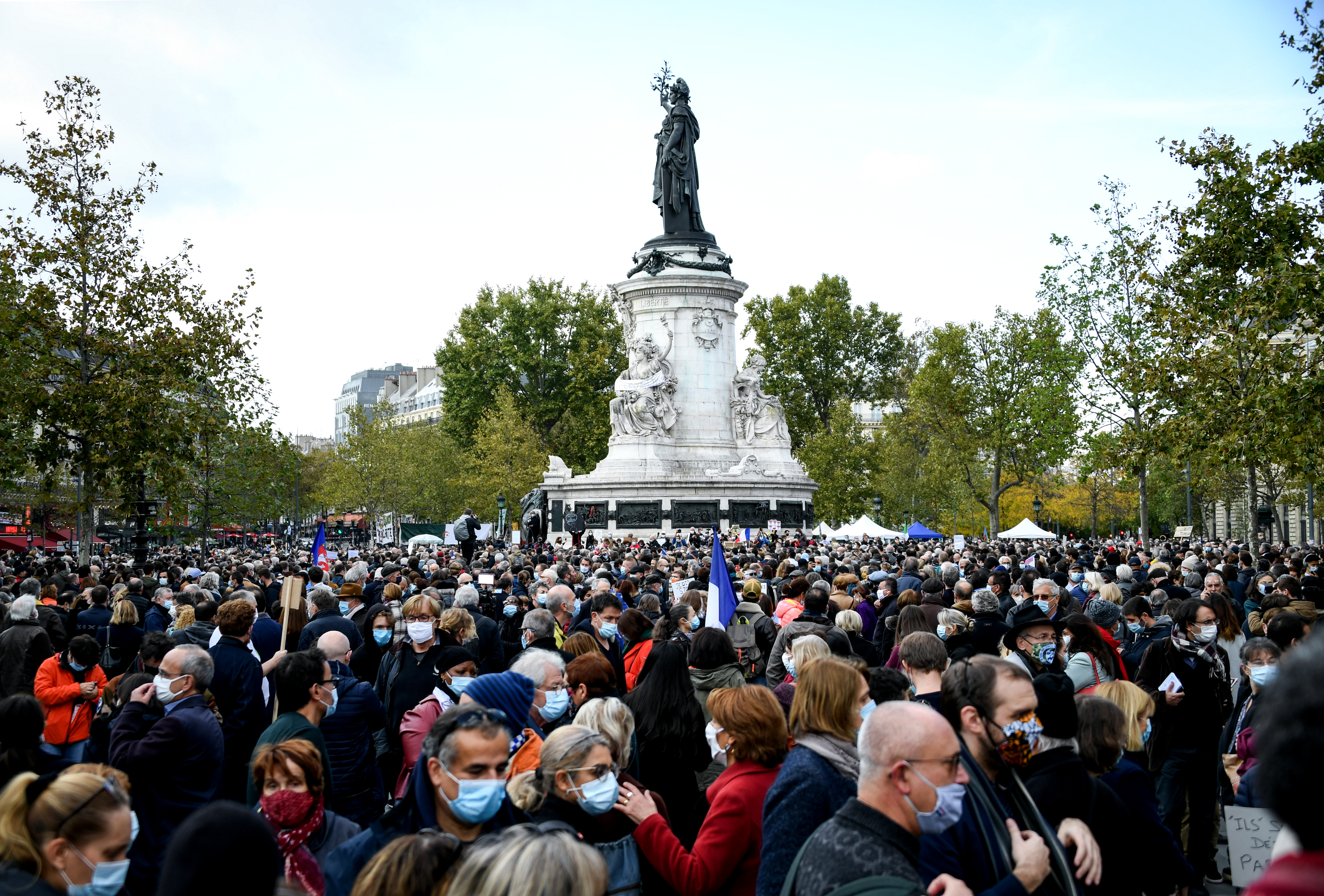 People gathered on Place de la Republique in Paris in solidarity with history teacher Samuel Paty who was attacked and beheaded outside his school on Friday