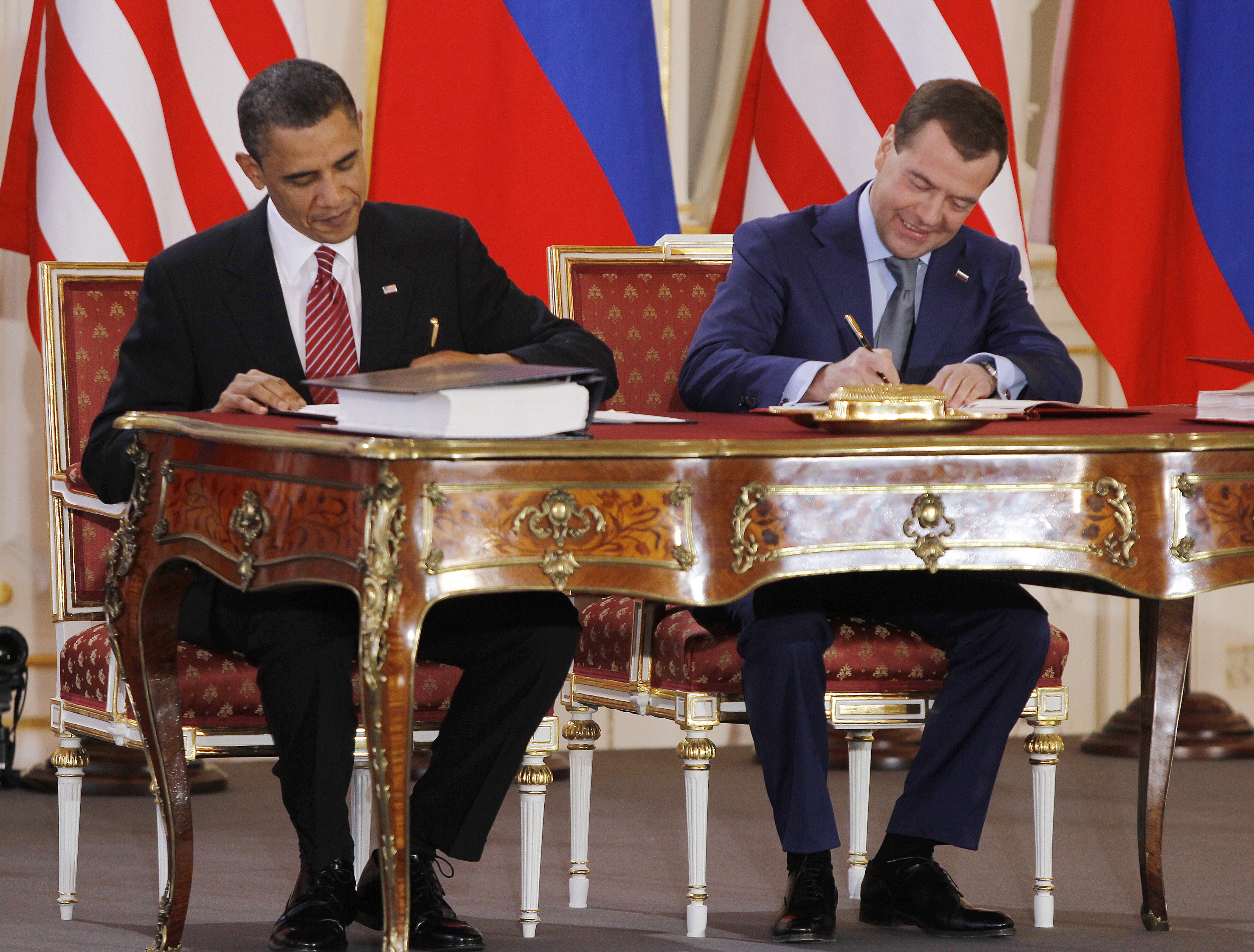 US President Barack Obama and Russian President Dmitry Medvedev signing the new Strategic Arms Reduction Treaty (START II) at Prague Castle in Prague on April 8, 2010