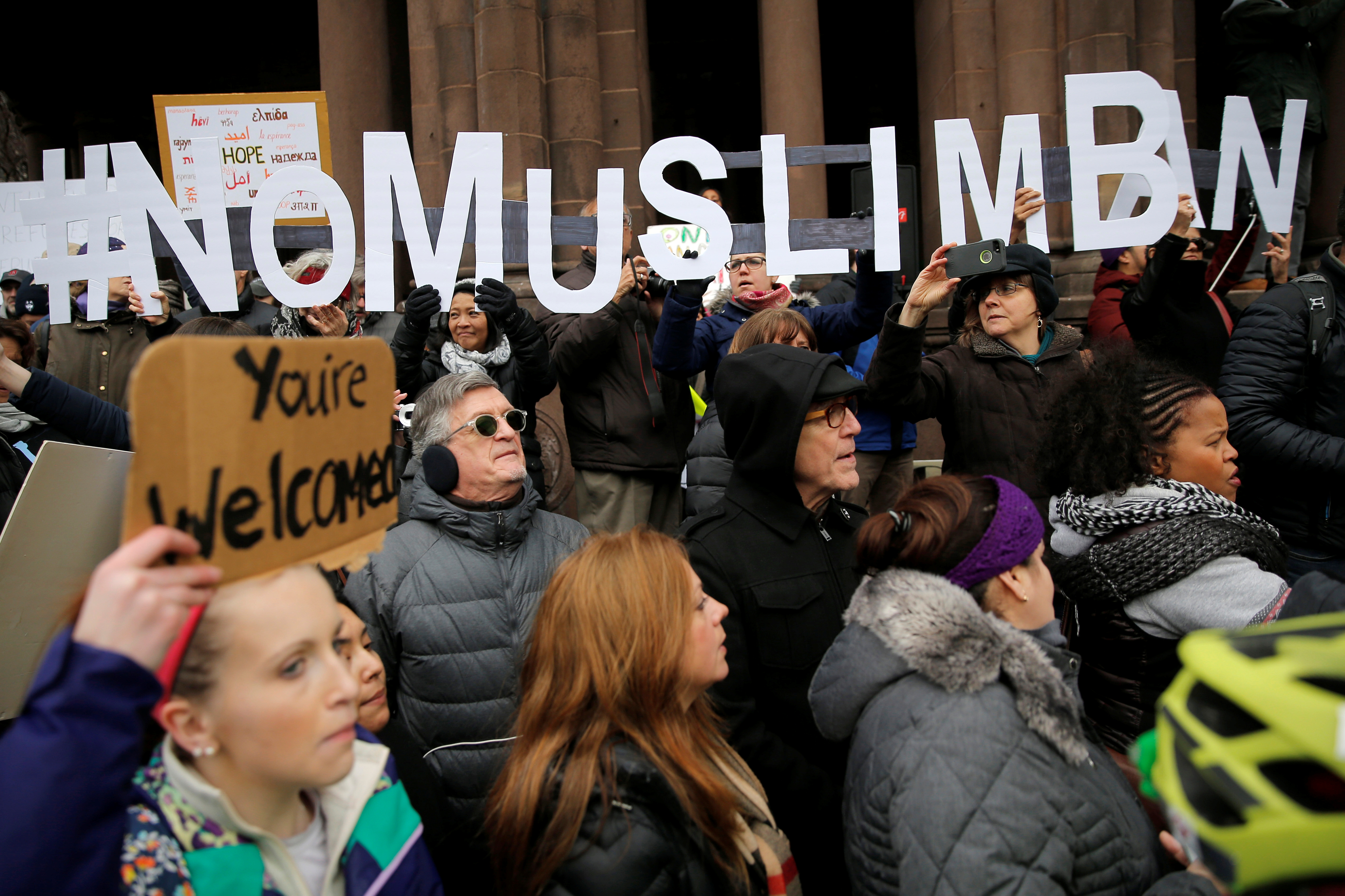Demonstrators spell out #No Muslim Ban during the Boston Protest Against Muslim Ban and Anti-Immigration Orders to protest US President Donald Trump’s executive order travel ban in Boston, Massachusetts January 29, 2017