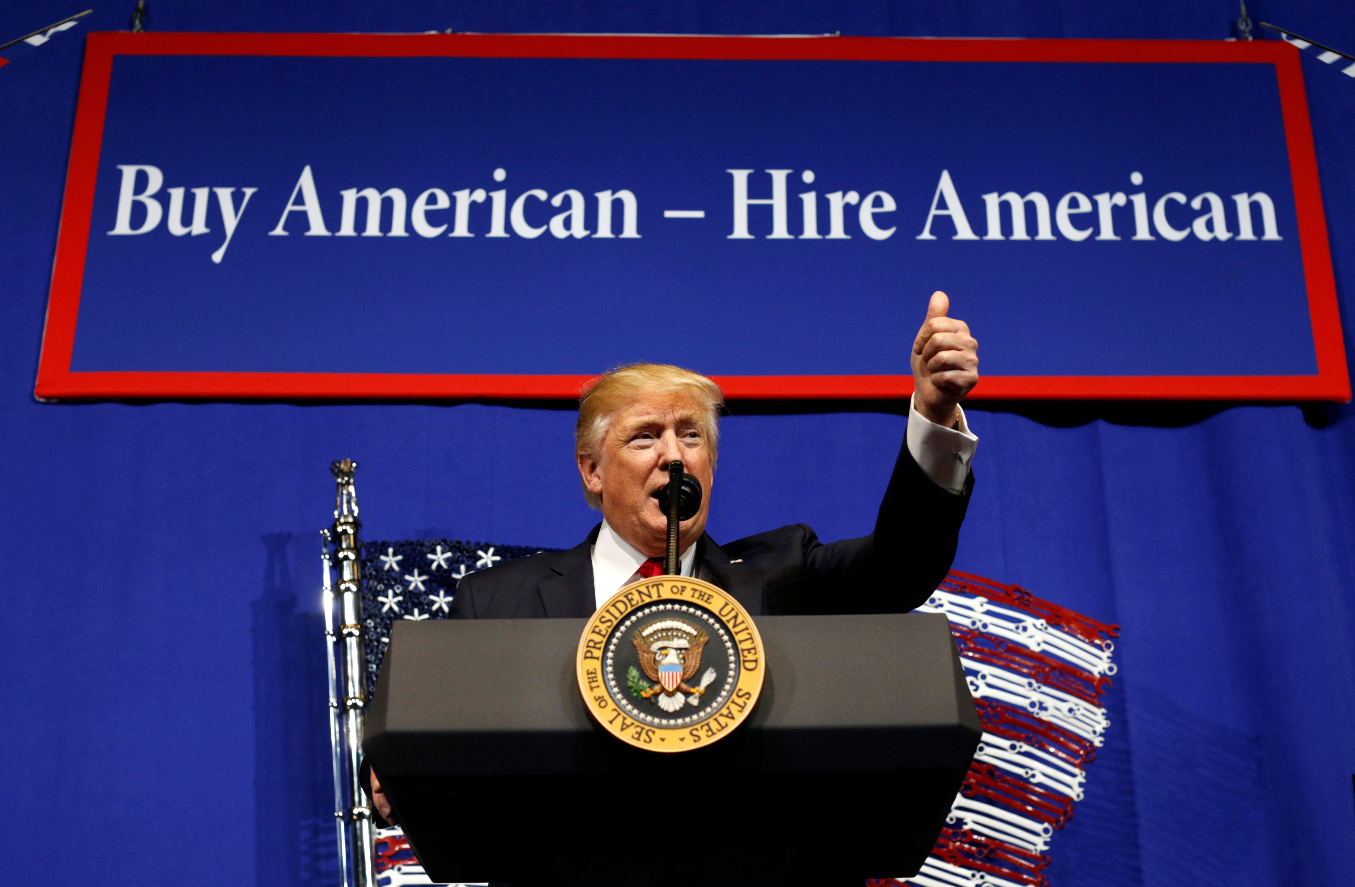 US President Donald Trump speaks before signing an executive order directing federal agencies to recommend changes to a temporary visa programme used to bring foreign workers to the United States to fill high-skilled jobs during a visit to the world headquarters of Snap-On Inc, a tool manufacturer, in Kenosha, Wisconsin, US, April 18, 2017