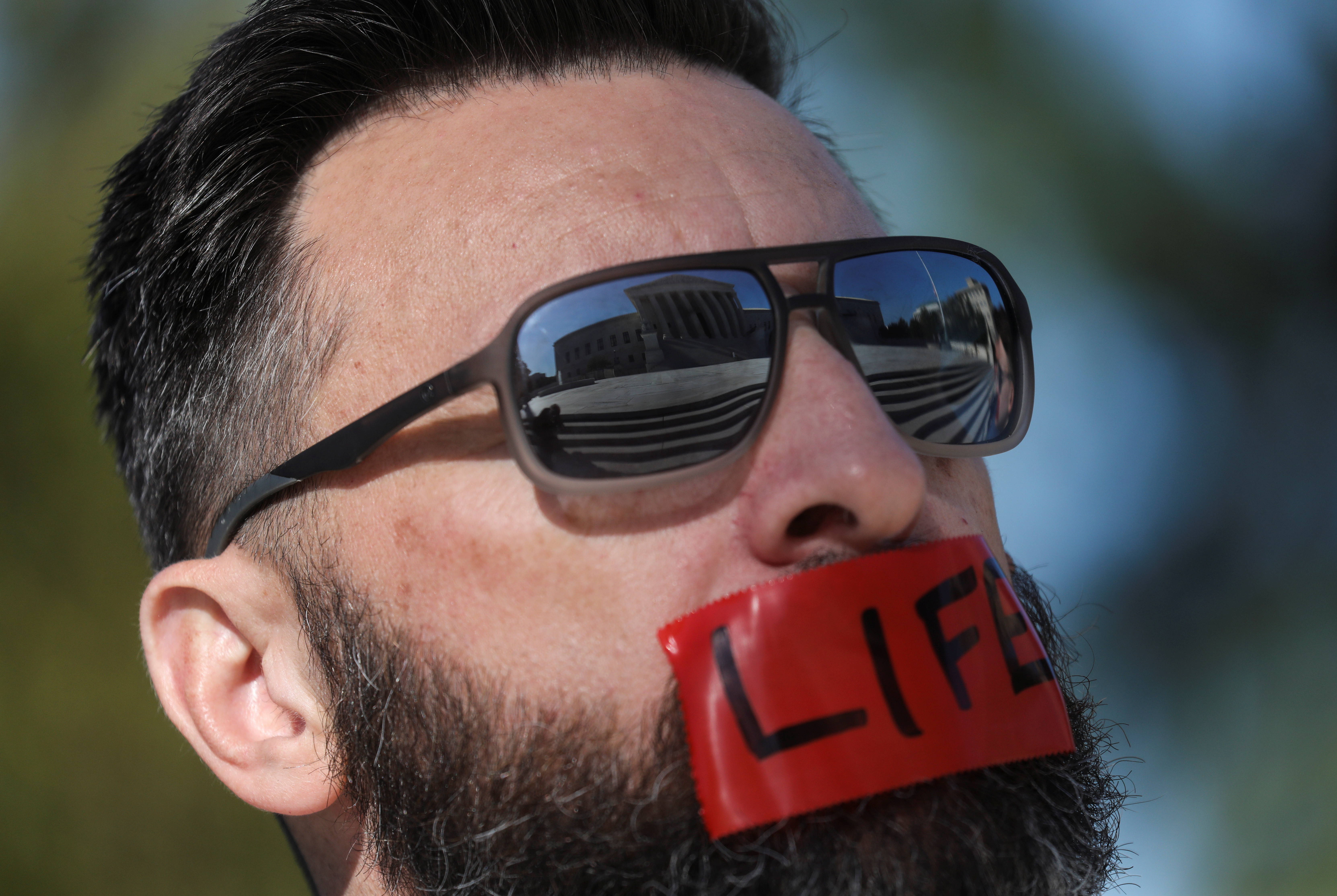 A member of the anti-abortion activist group Bound4LIFE demonstrating outside the US Supreme Court as justices returned to work for the first time since Ruth Bader Ginsburg’s death