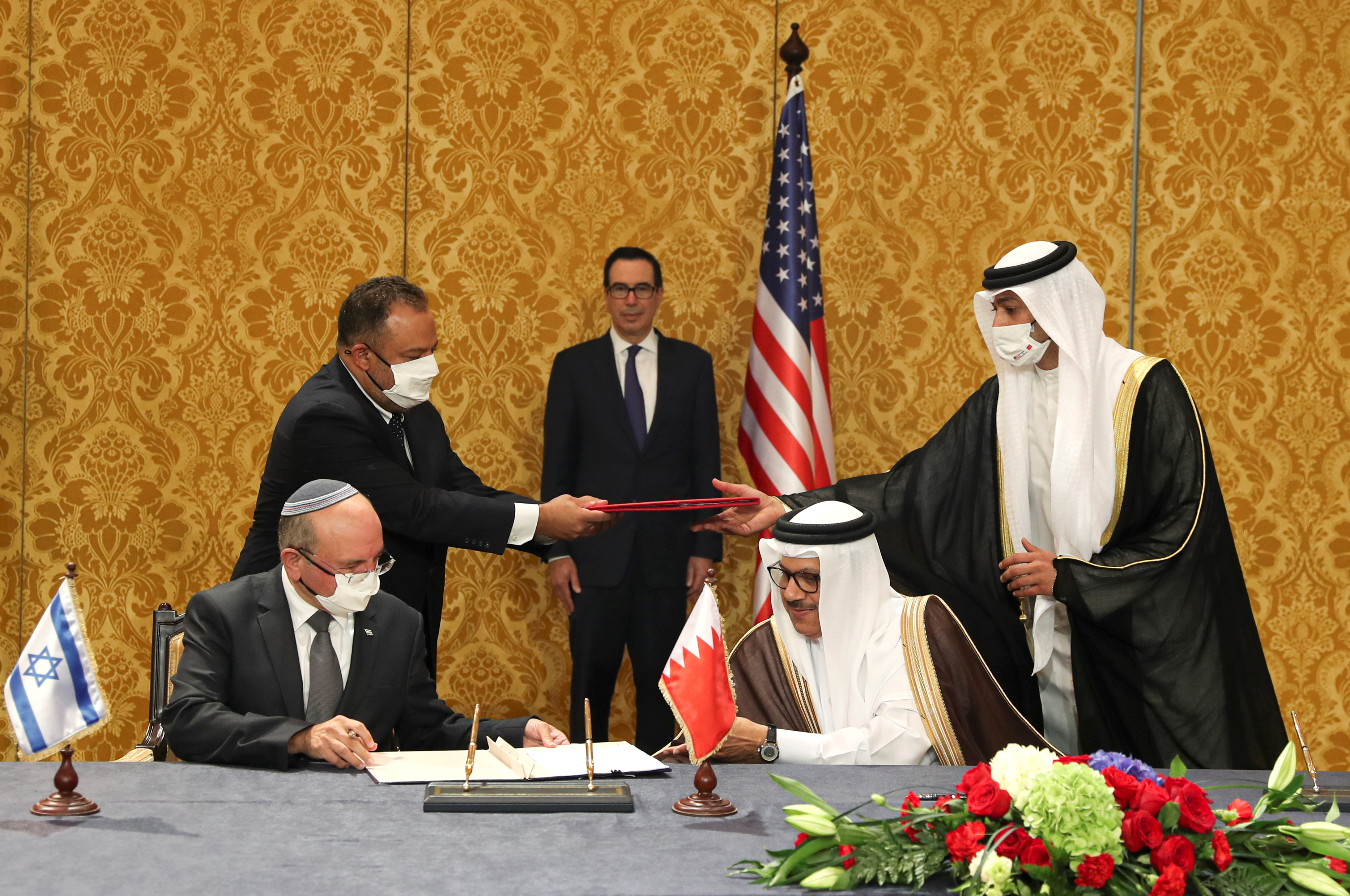 An Israeli delegation signs an agreement with Bahraini officials