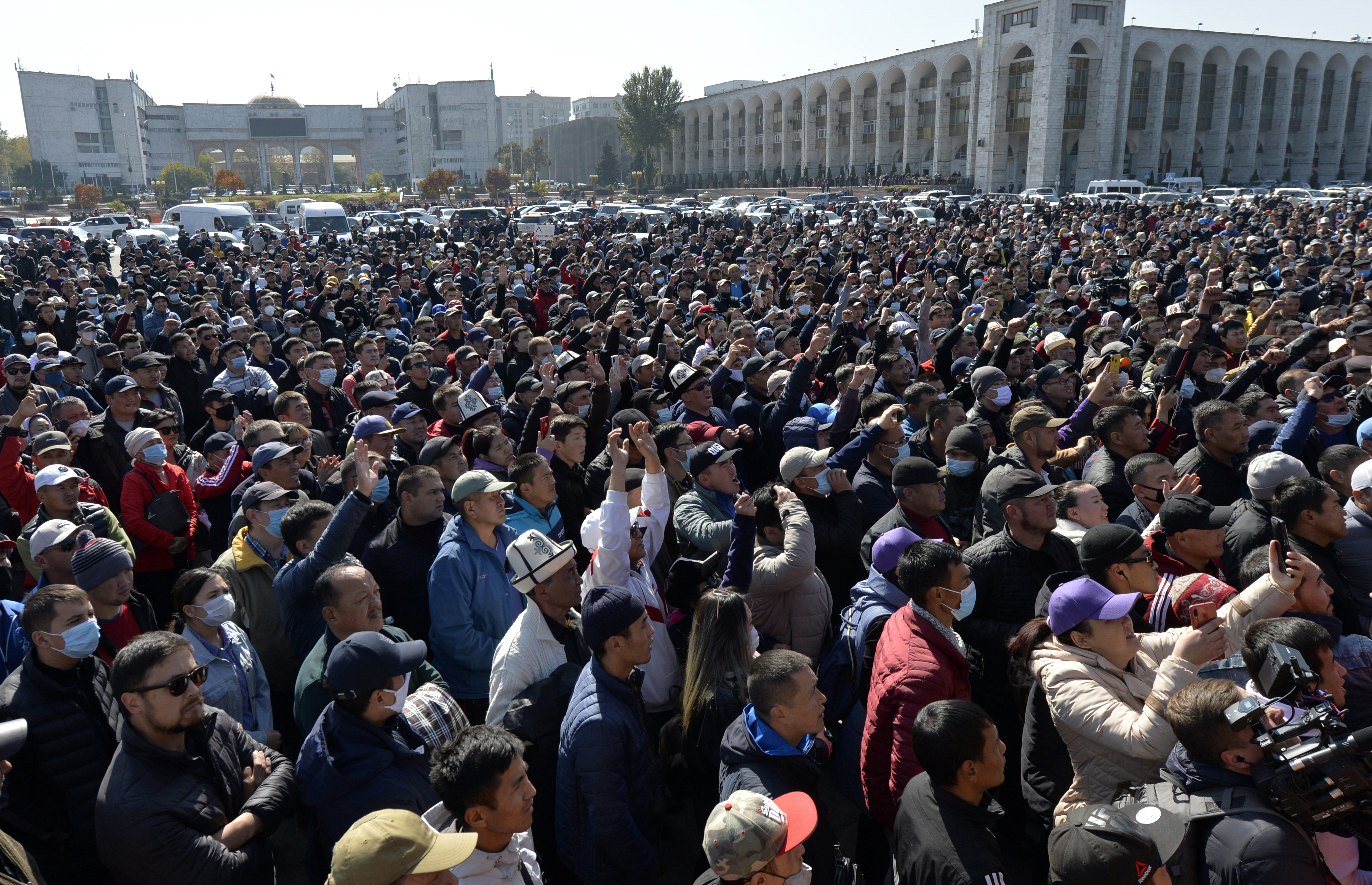 People protest during a rally on the central square in Bishkek, Kyrgyzstan, Wednesday, Oct. 7, 2020