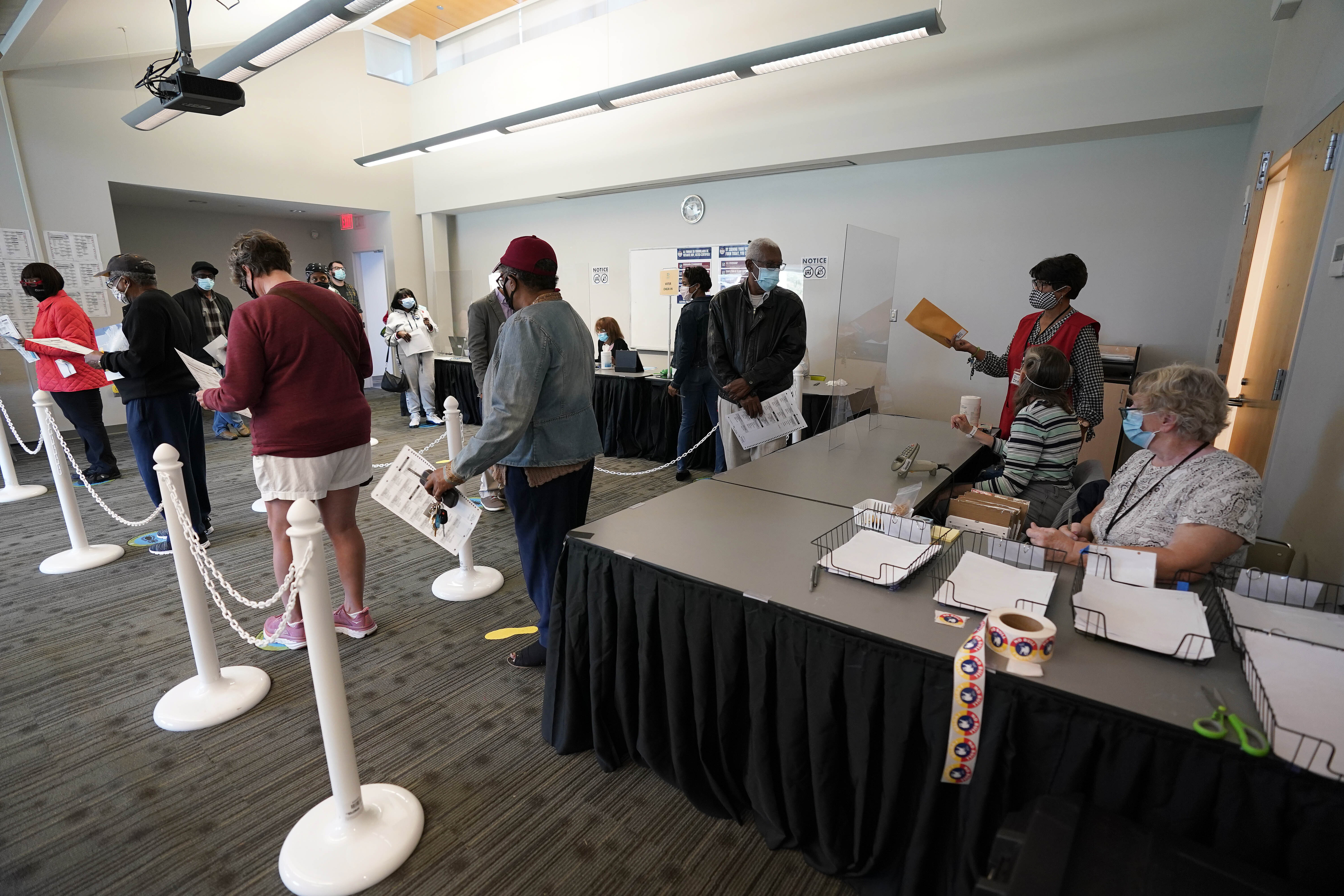 Early voters lined up to cast their ballots inside the South Regional Library polling location in Durham, North Carolina on October 15, 2020.