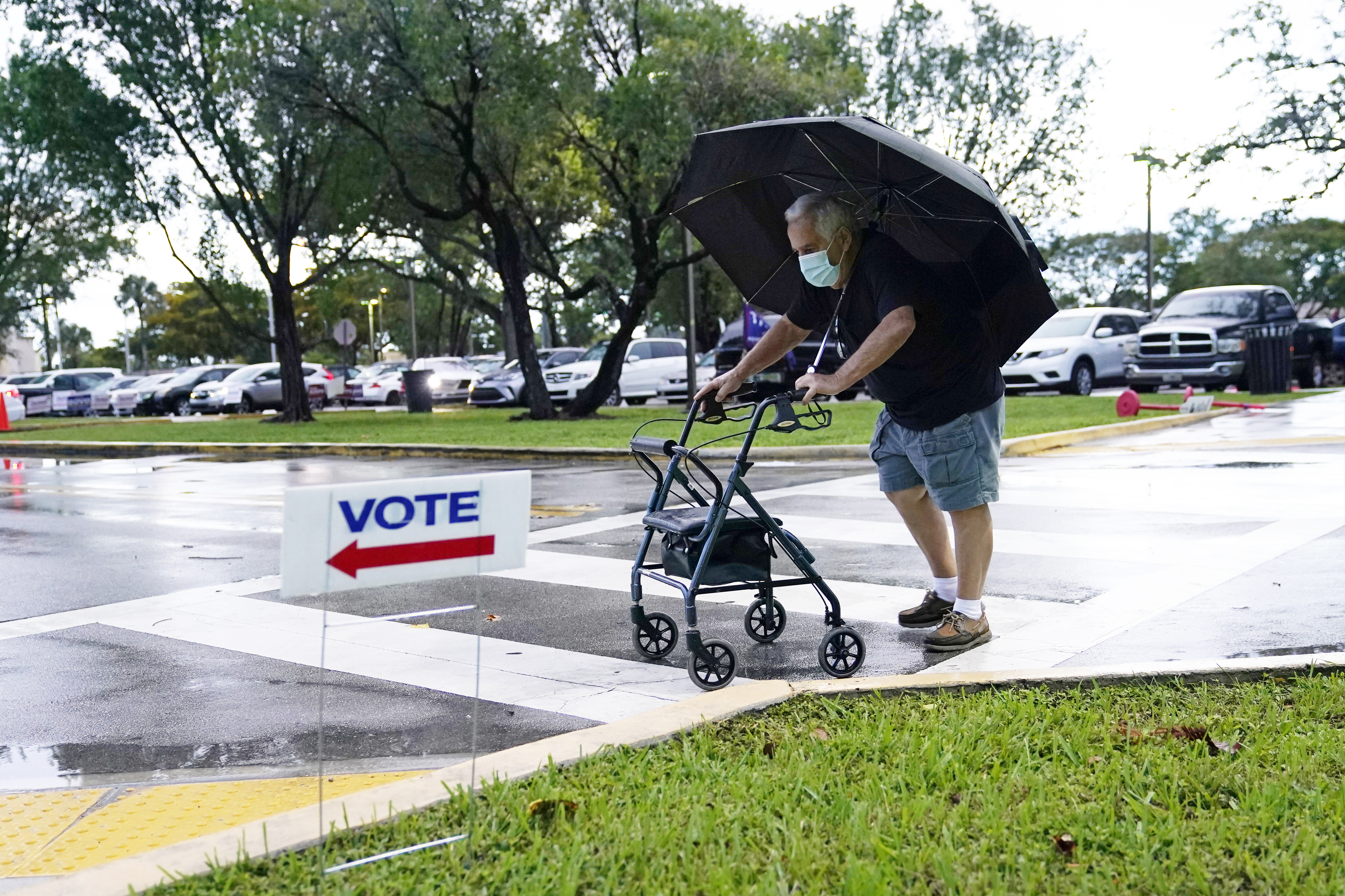 A voter walks to an early voting site in Miami. Florida