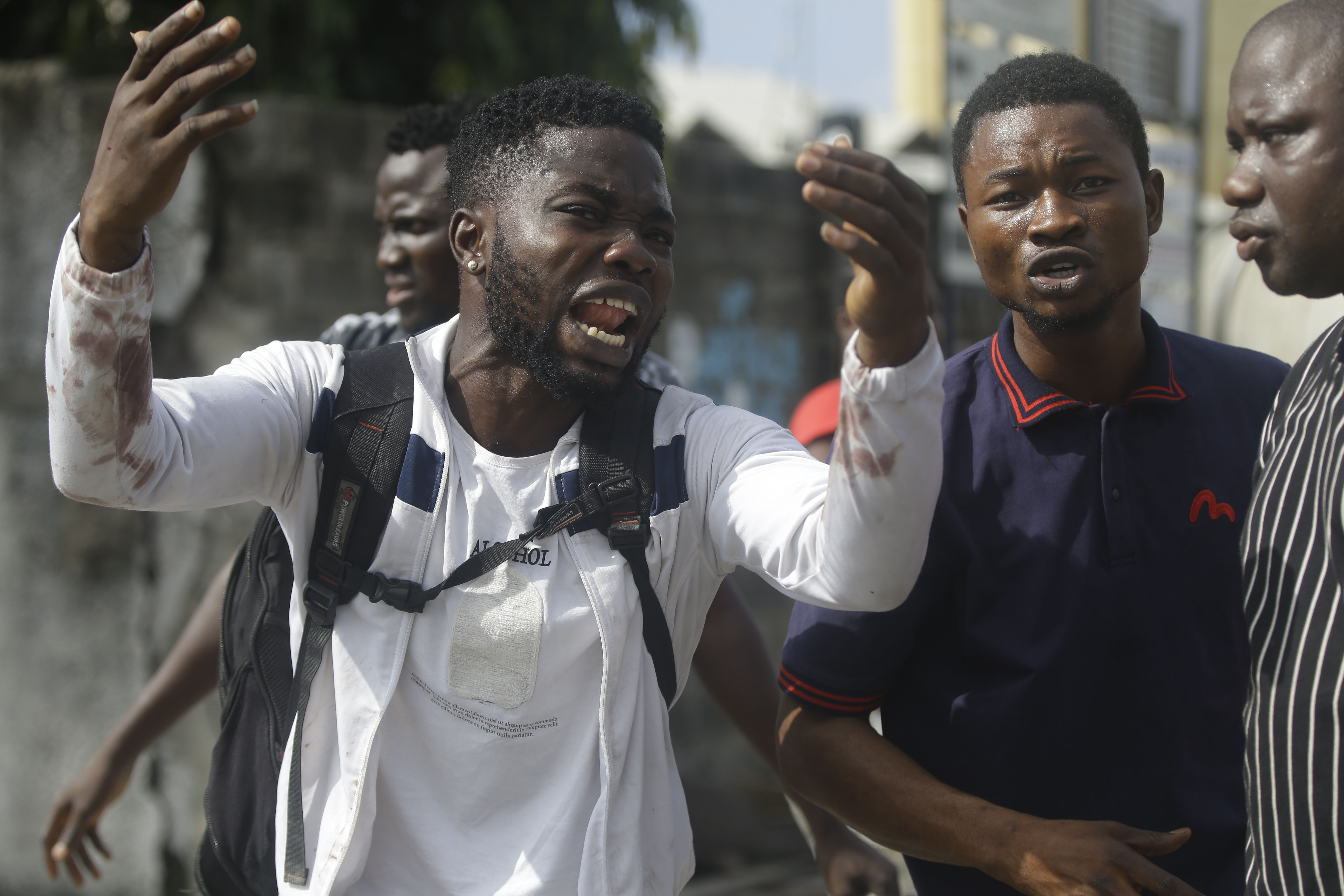 Alister, a protester who said his brother Emeka died from a stray bullet from the army, reacts while speaking near Lekki toll gate in Lagos on Tuesday