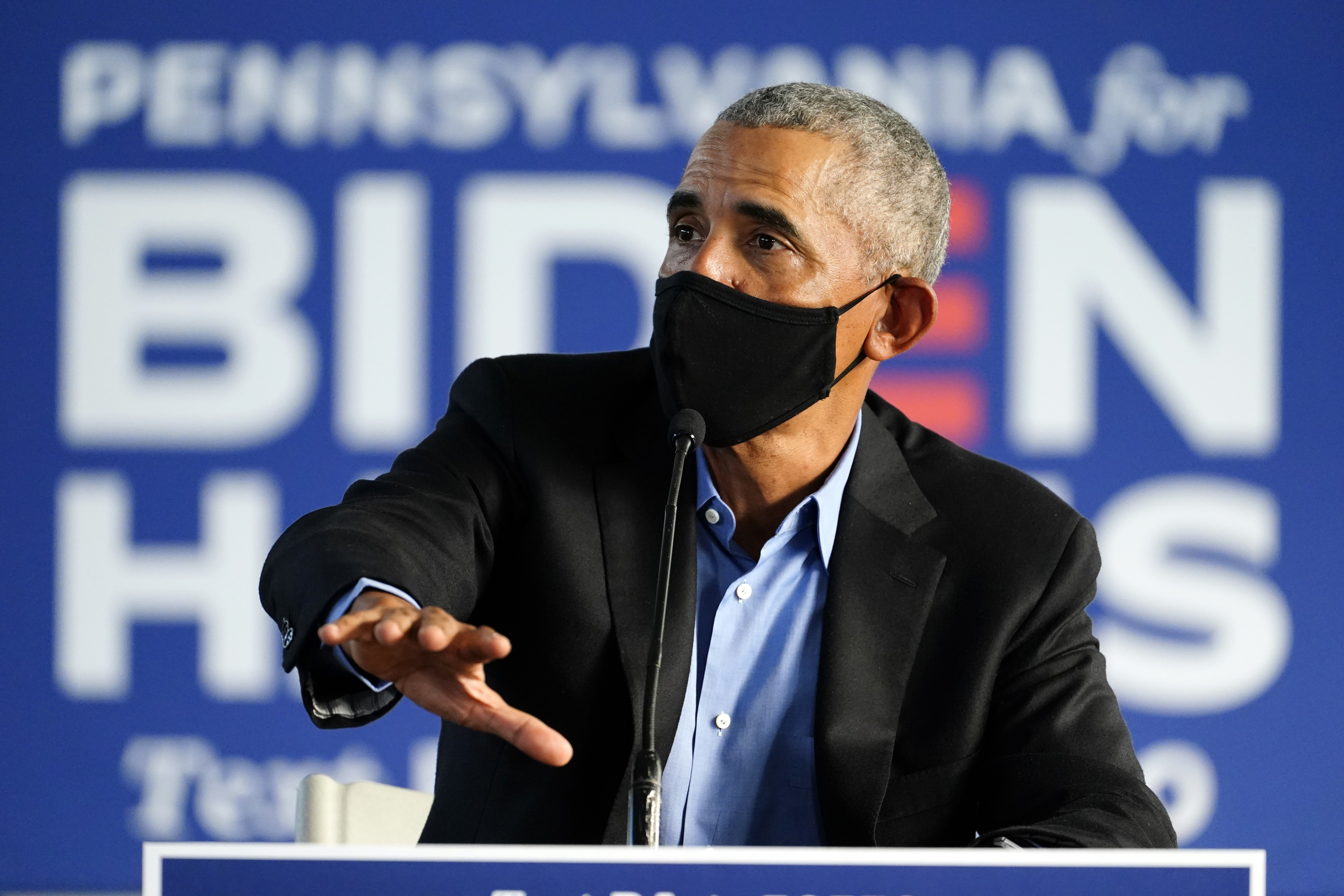 Former President Barack Obama speaks during a campaign roundtable in Philadelphia