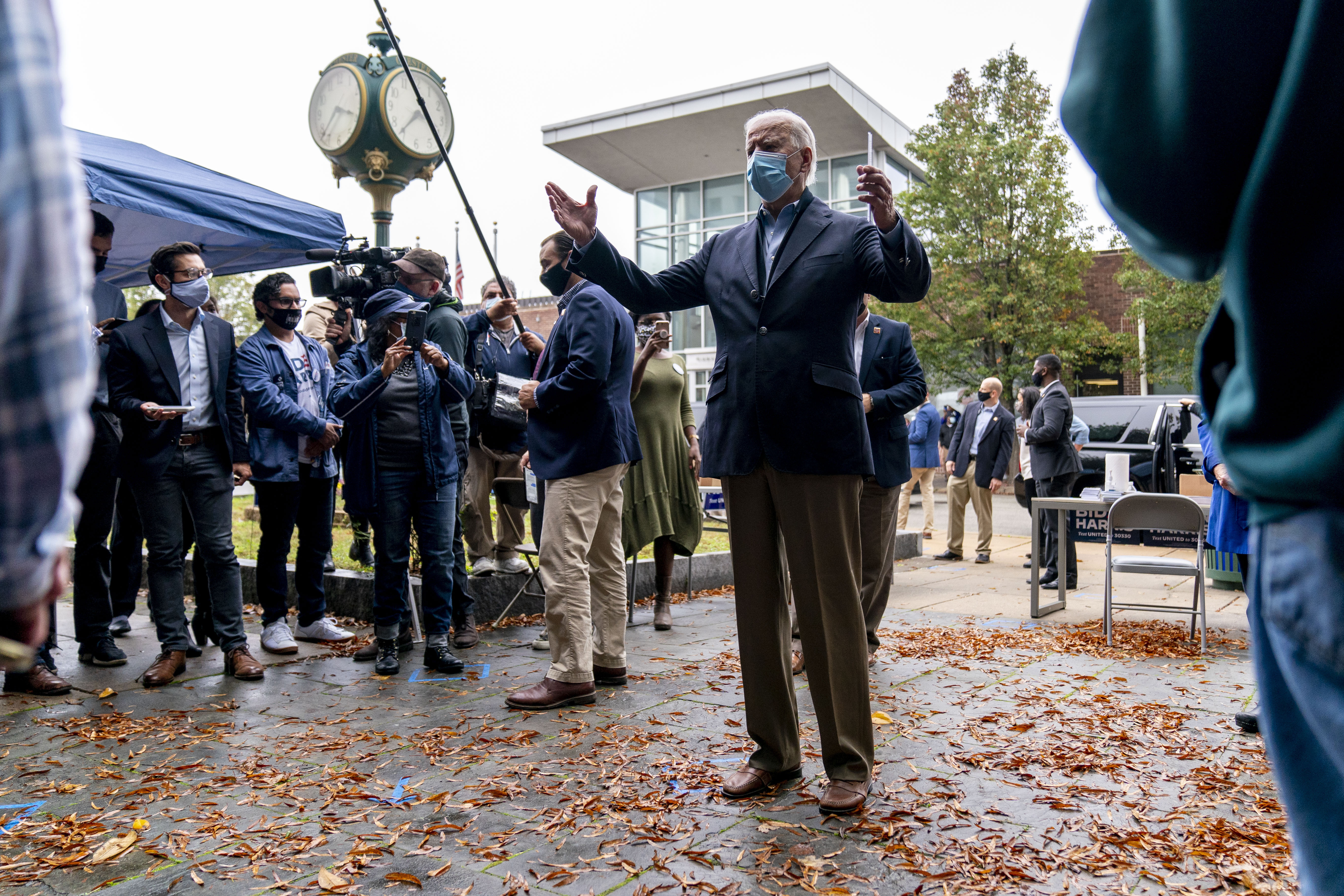 Democratic presidential candidate Joe Biden speaks with supporters outside a voter service centre in Chester, Pennsylvania on October 26, 2020