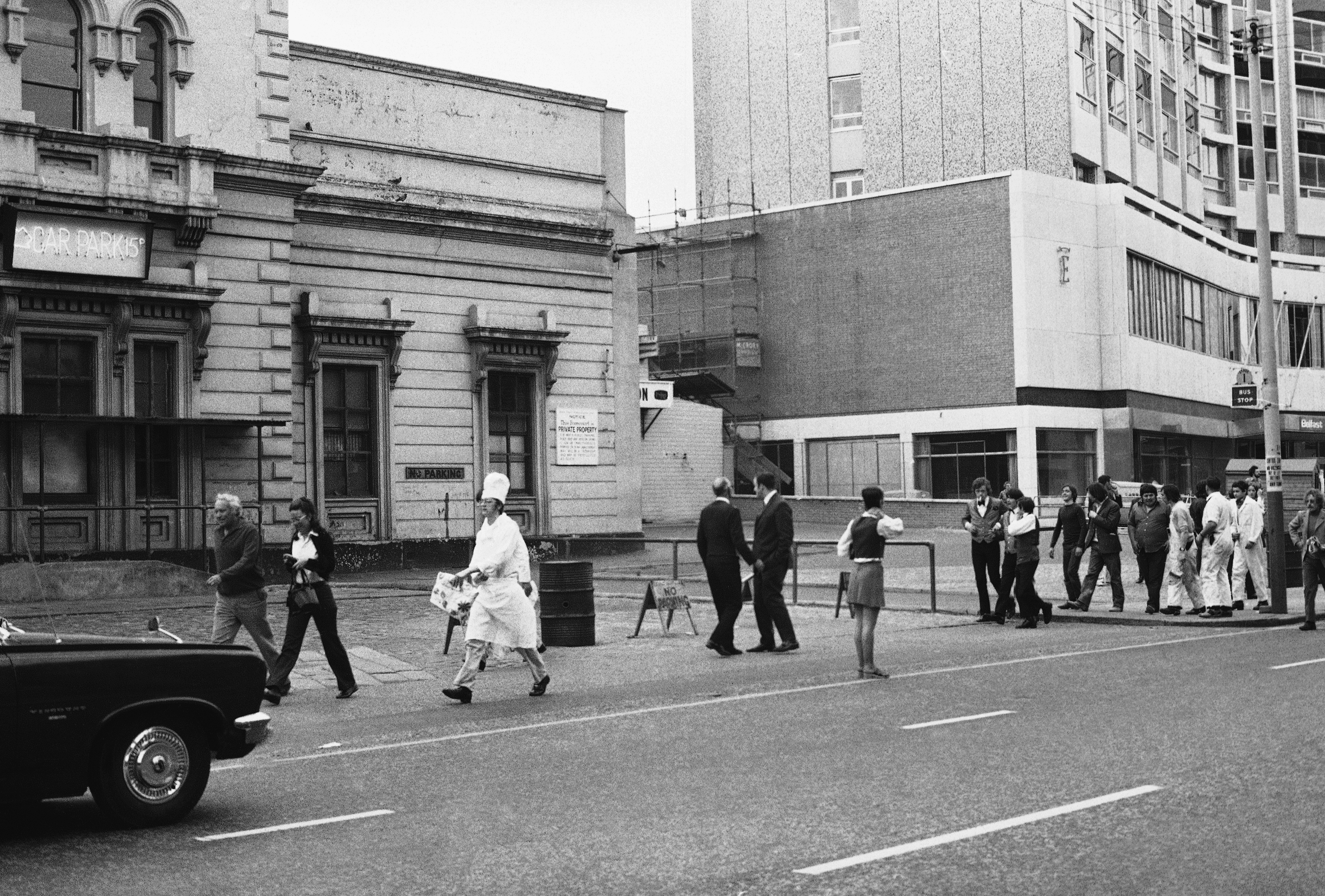 Guests and hotel staff make an orderly exit from The Europa Hotel on September 7, 1972