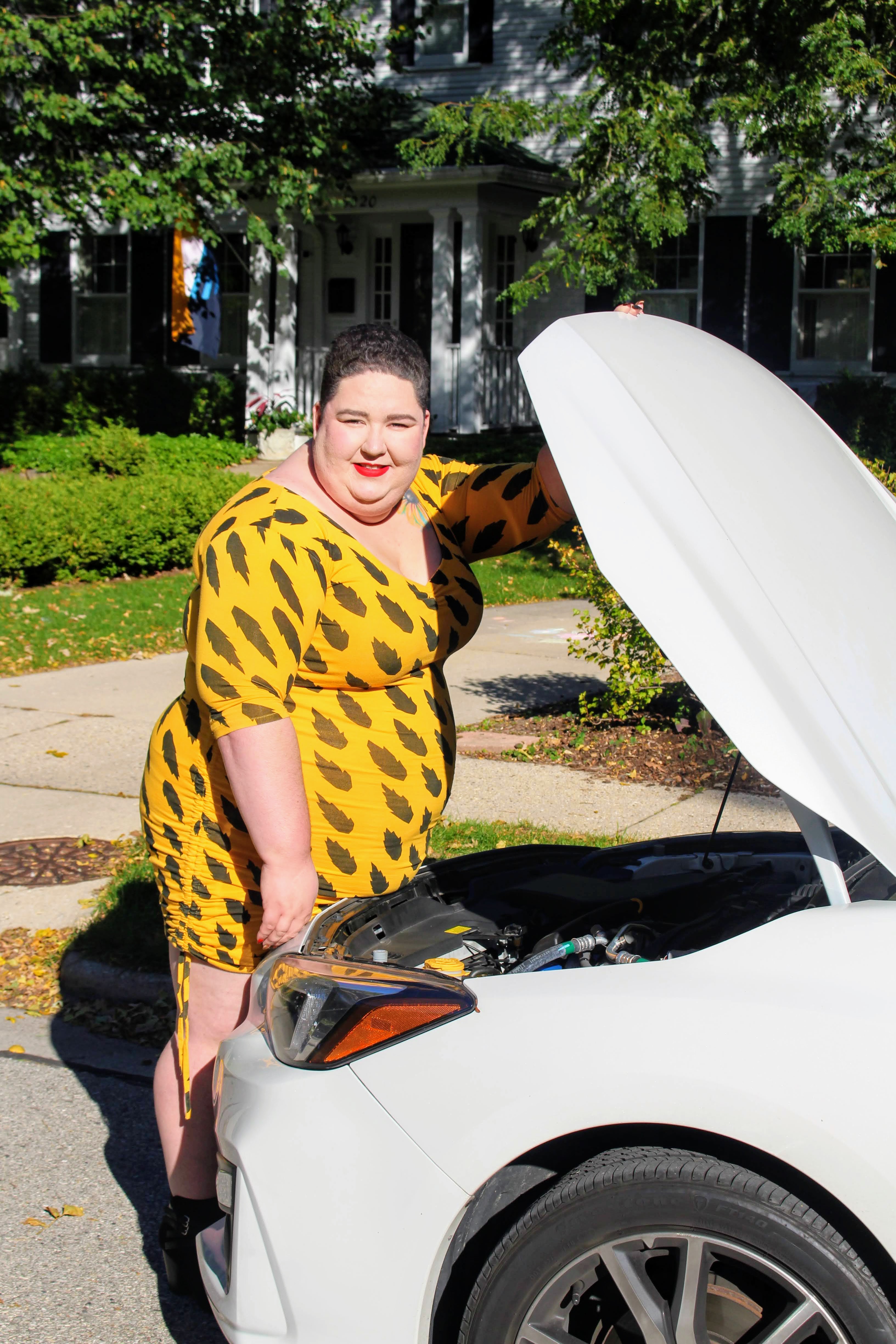 The writer working on a car [Photo courtesy Chana Milchtein]