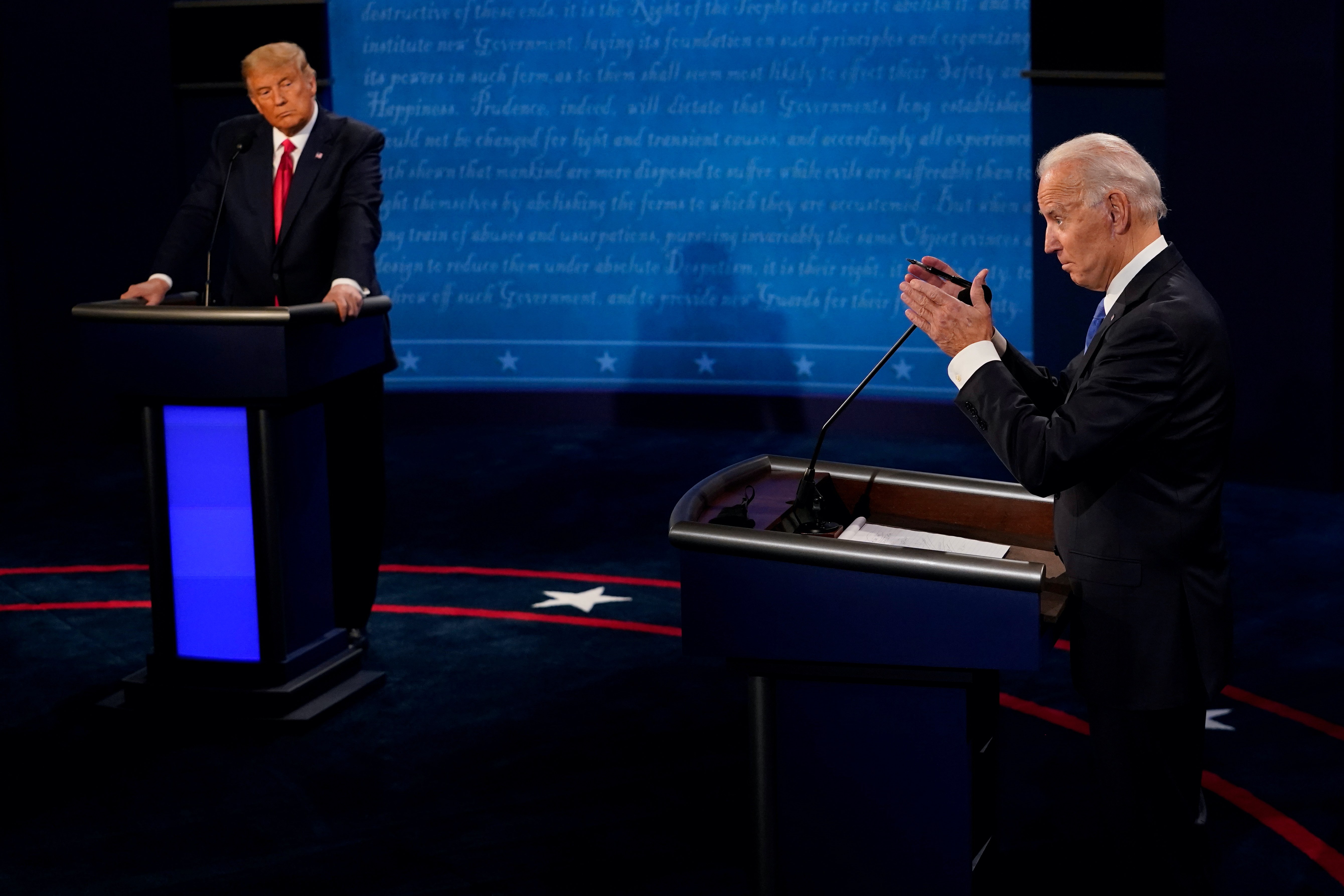 Democratic presidential candidate, former Vice President Joe Biden, answers a question as President Donald Trump listens during the second and final presidential debate at the Curb Event Center at Belmont University in Nashville, Tennessee