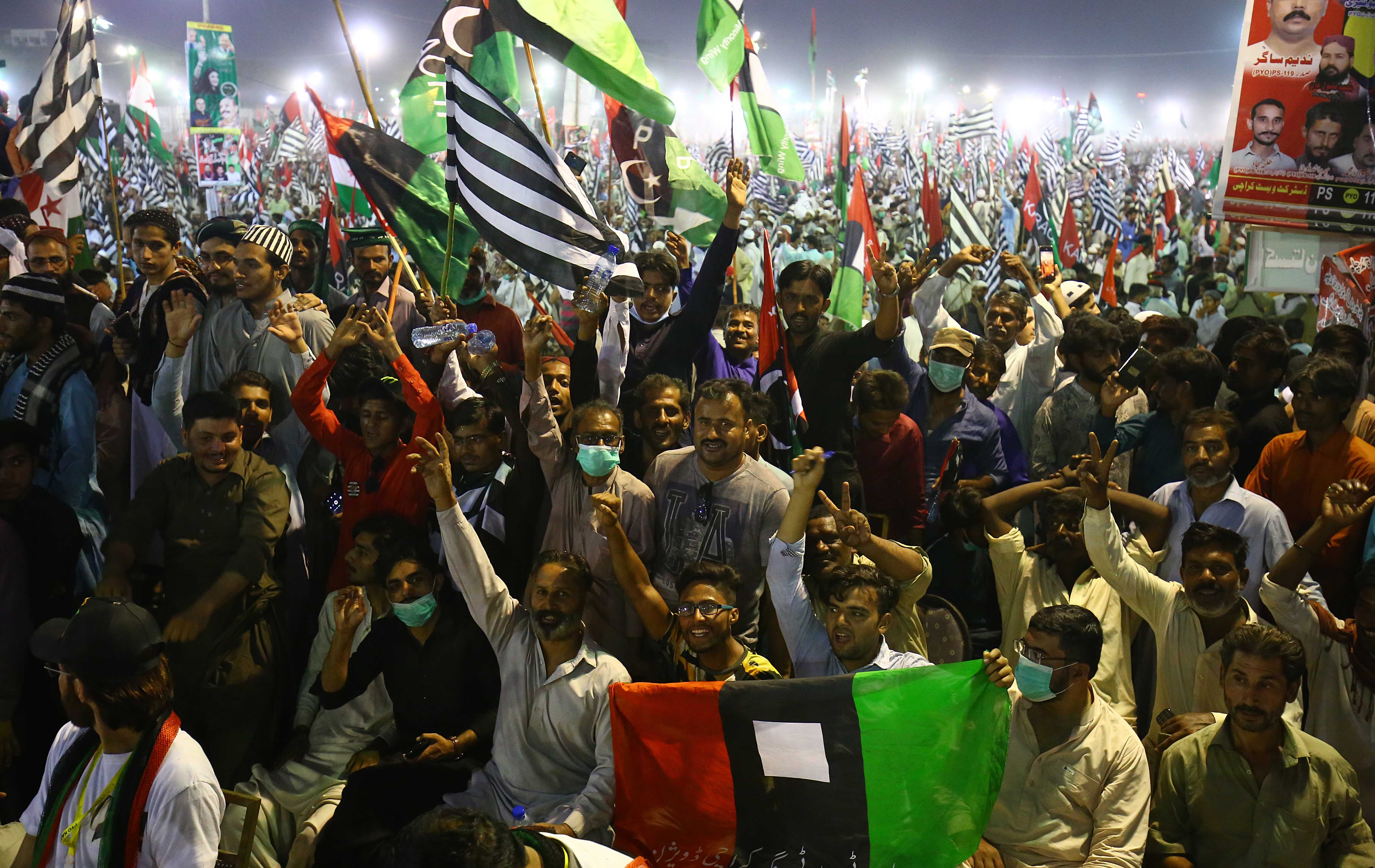 Supporters of major opposition political parties including Pakistan Muslim League Nawaz (PMLN) gather during an anti-government rally in Karachi [Shahzaib Akber/EPA]