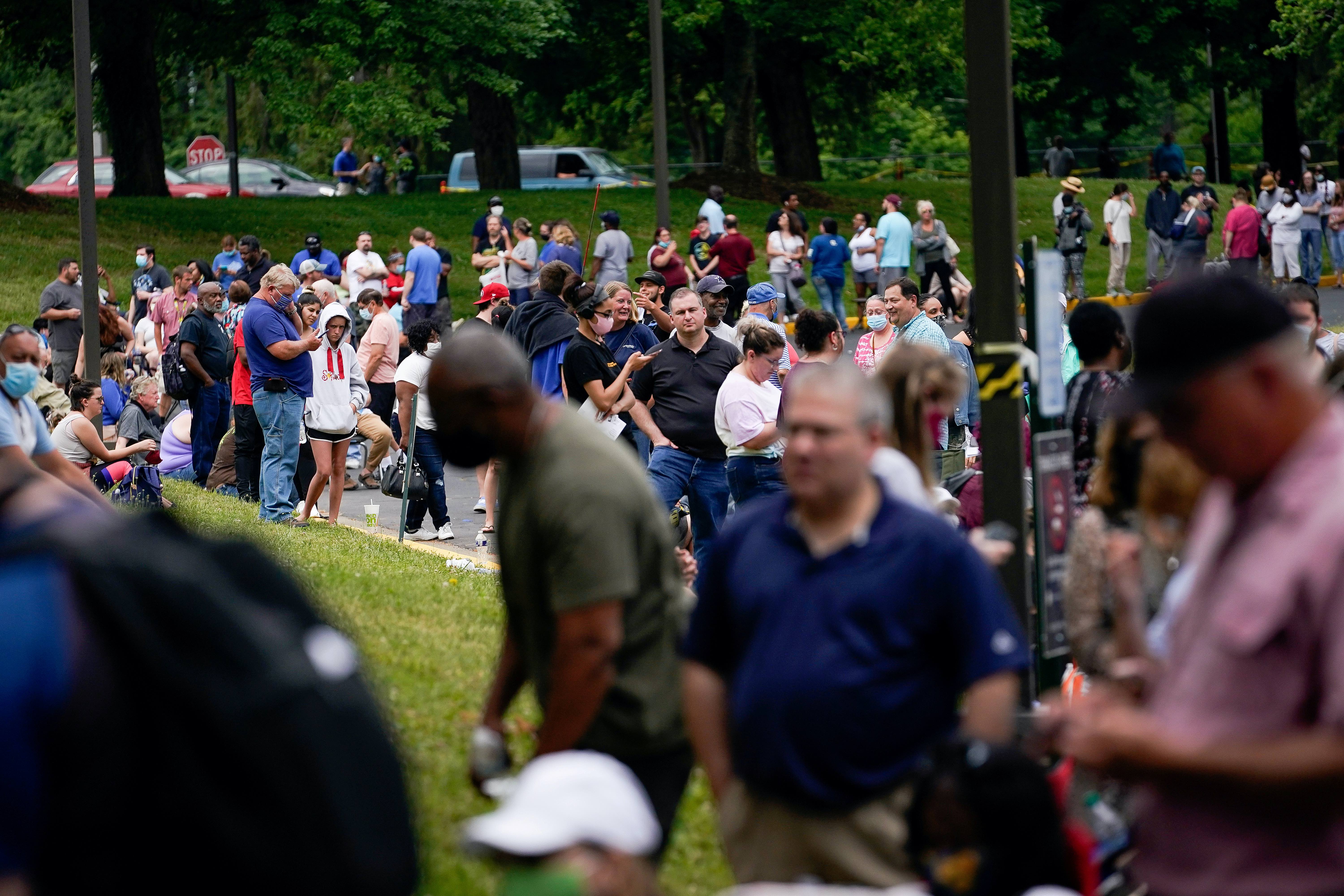 Hundreds of people line up outside a Kentucky Career Center hoping to find assistance with their unemployment claim in Frankfort, Kentucky, United States