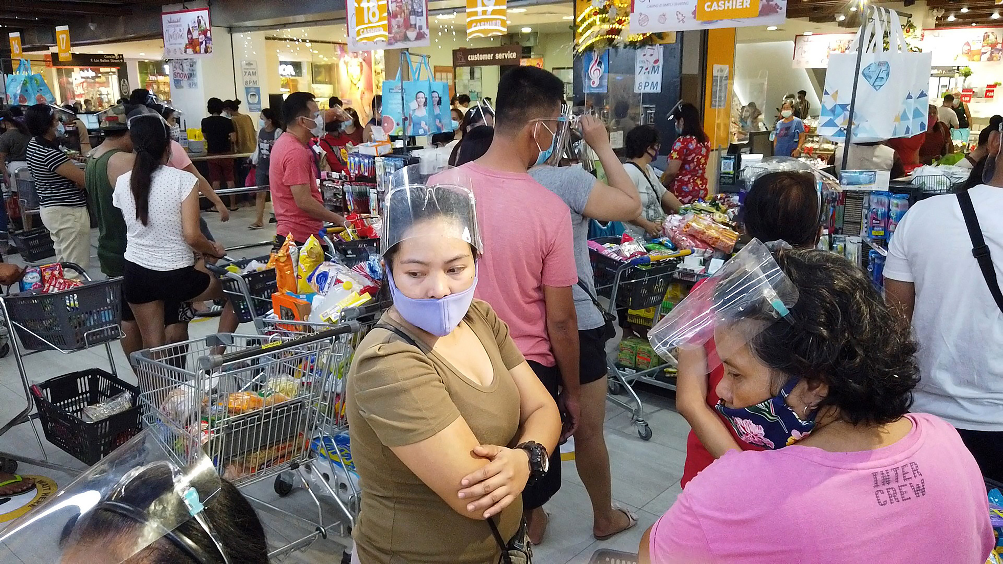 Residents crowd a grocery store to buy essential goods in Legaspi, Albay province, south of Manila on October 31, 2020, in advance of Typhoon Goni landfall