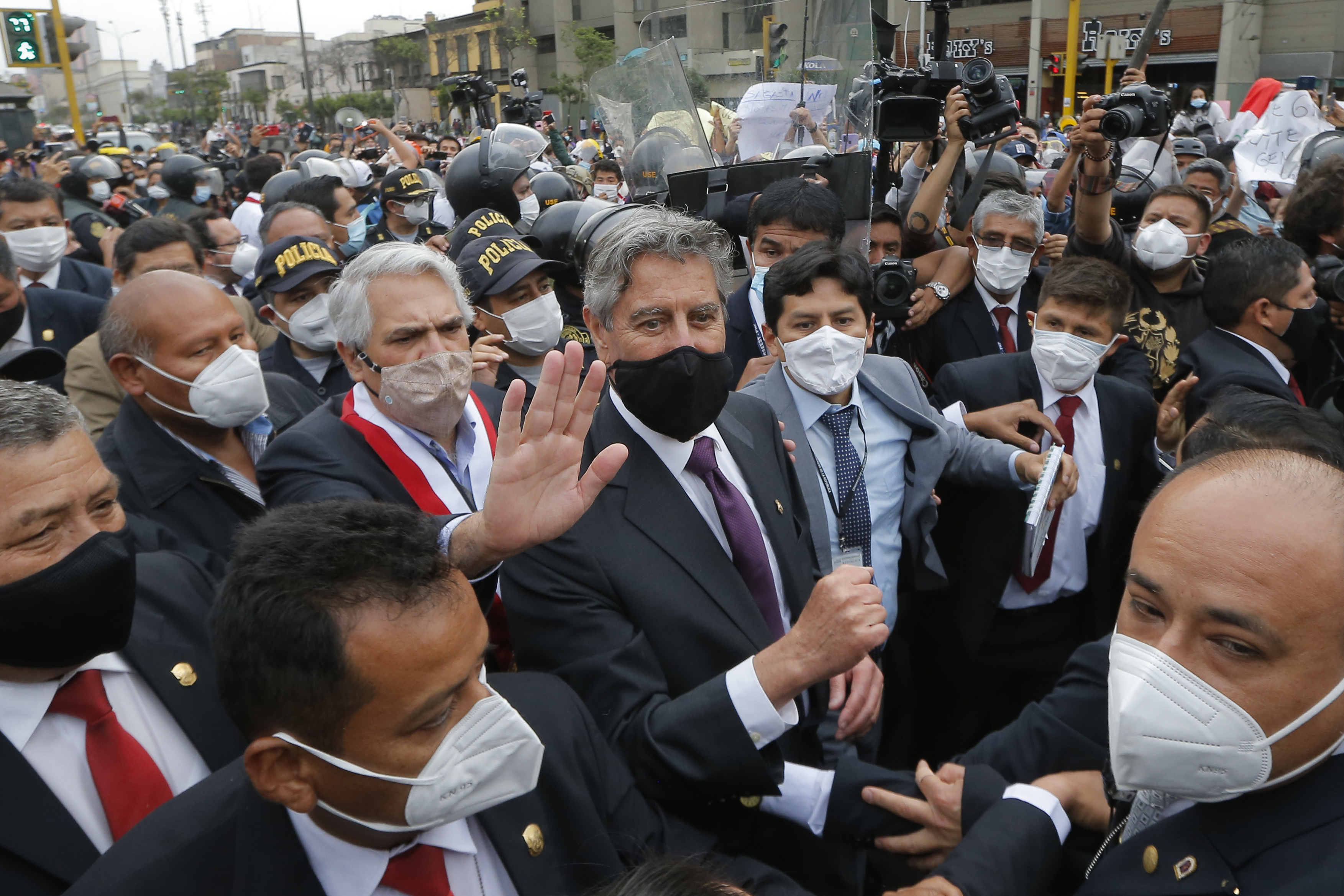 Francisco Sagasti, centre, leaves the Congress after being chosen as Peru’s interim President in Lima, on November 16, 2020