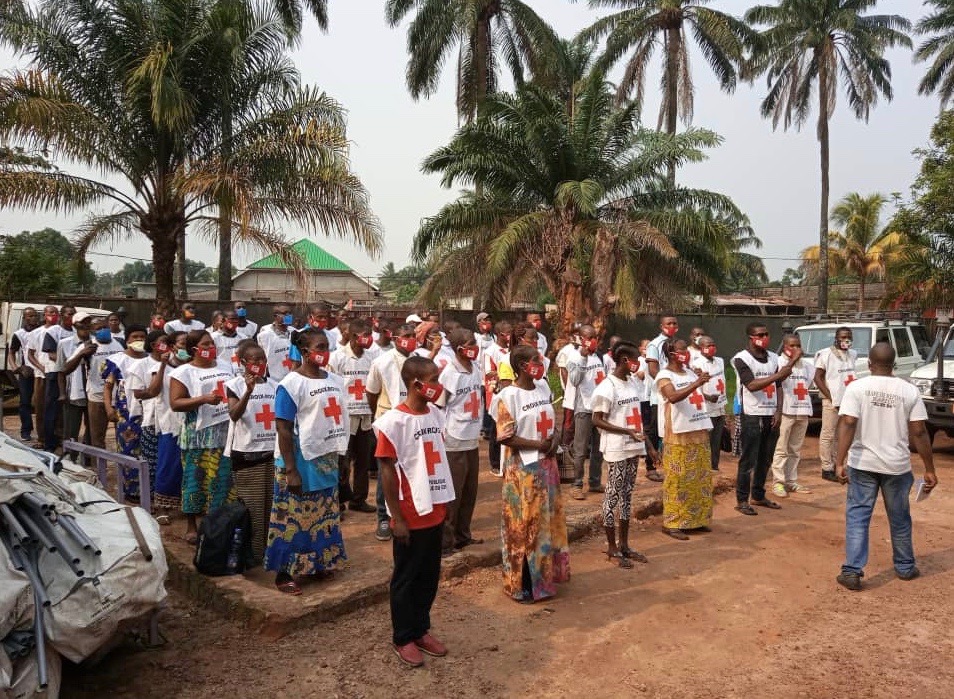 Red Cross volunteers in Equateur province are briefed before heading out into their communities to share life-saving information on the prevention of both Ebola and COVID-19 [Red Cross]