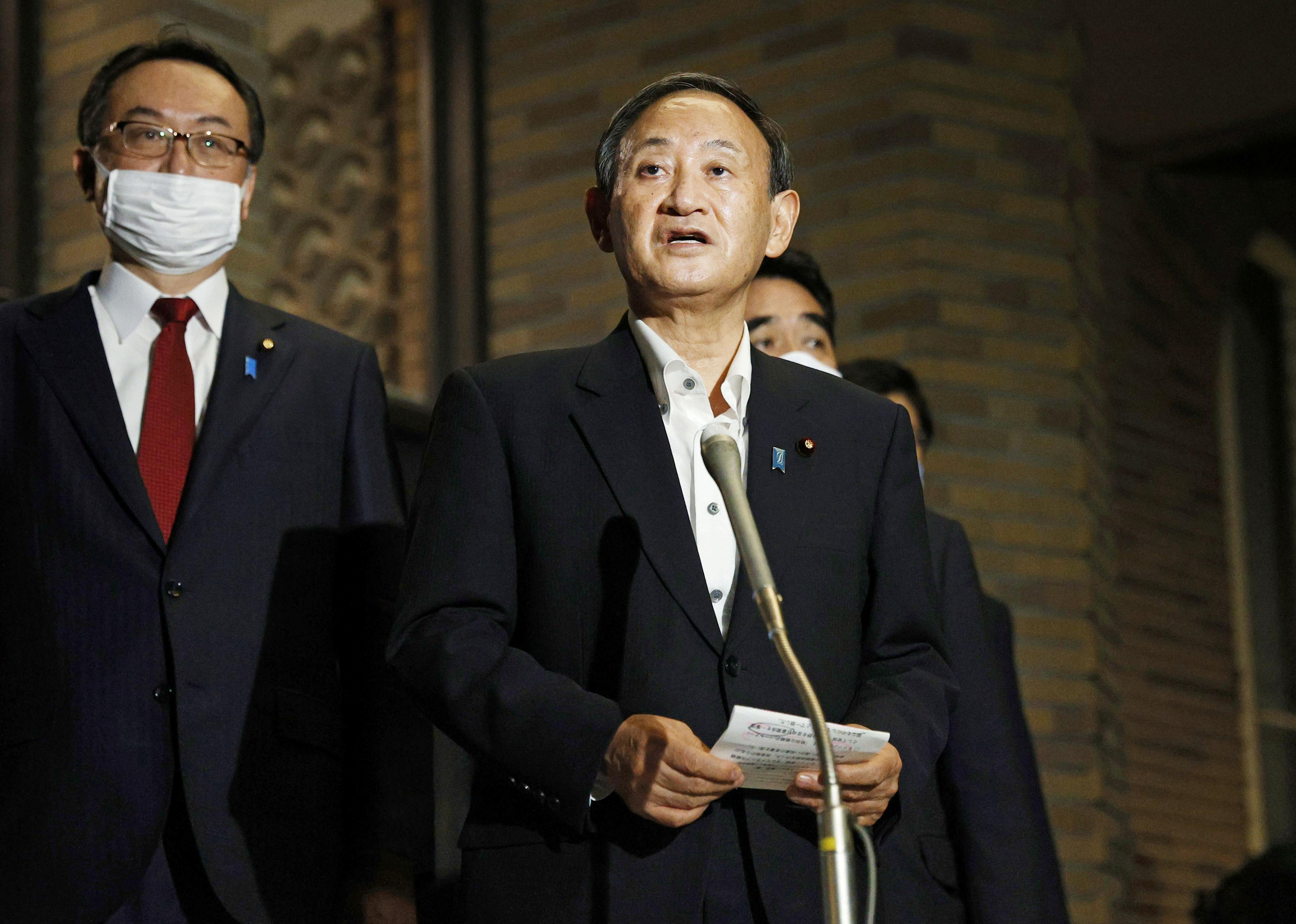 Japanese Prime Minister Yoshihide Suga said he and President-elect Biden discussed a visit to the White House soon after Biden is inaugurated on January 20 [Kyodo via Reuters]