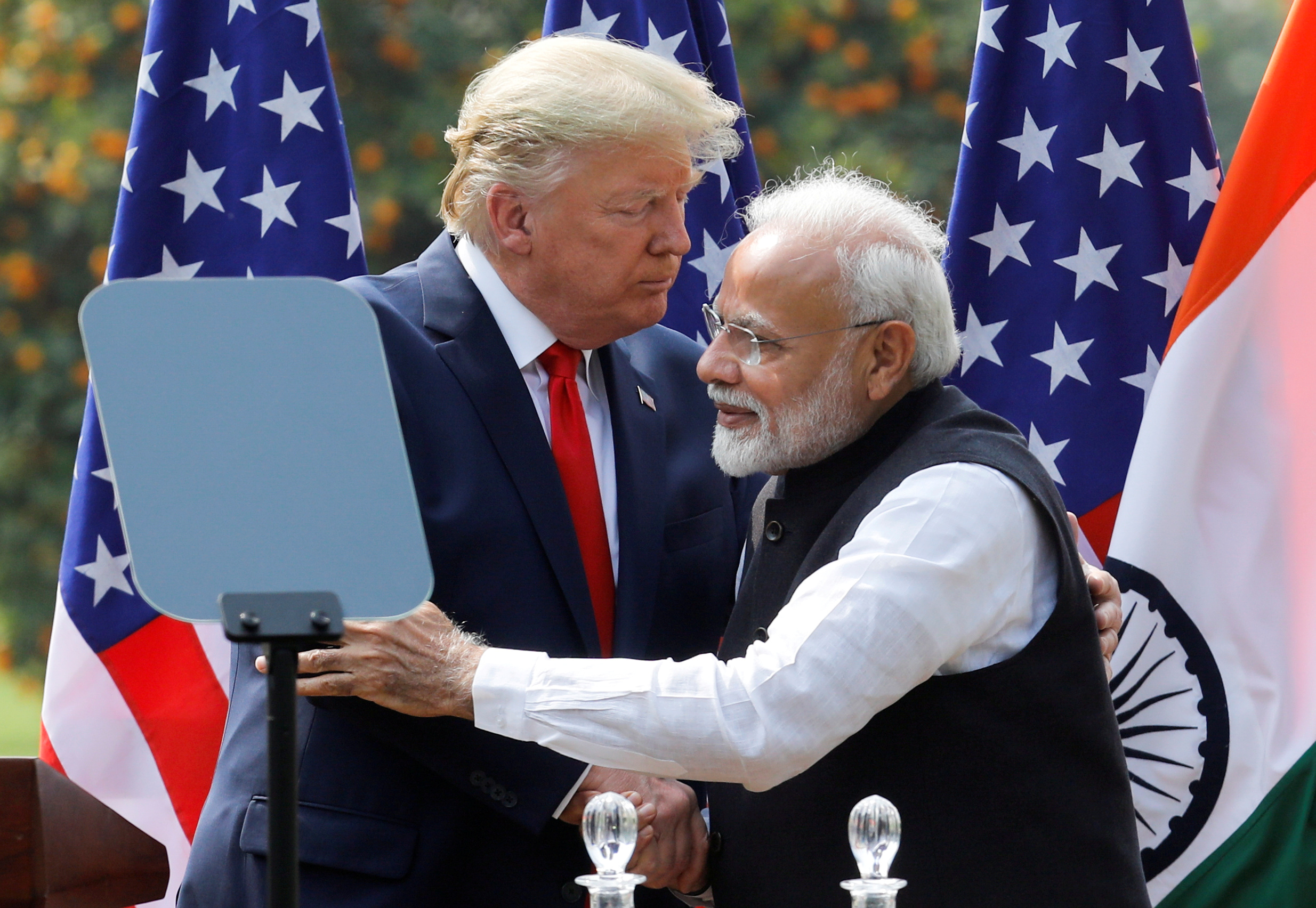 US President Donald Trump and India’s Prime Minister Narendra Modi embrace at a joint news conference after bilateral talks in New Delhi