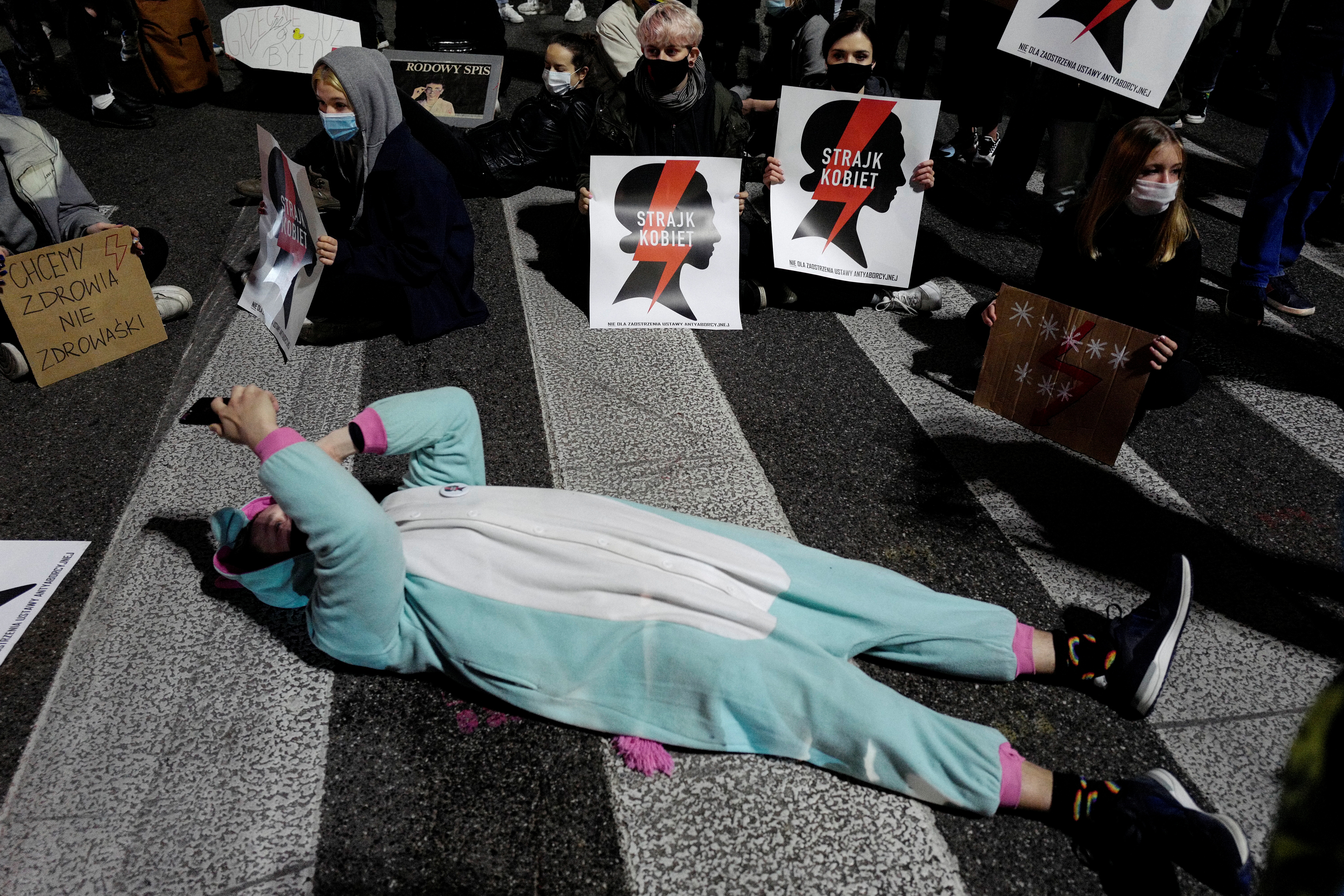Demonstrators block a street during an anti-government protest