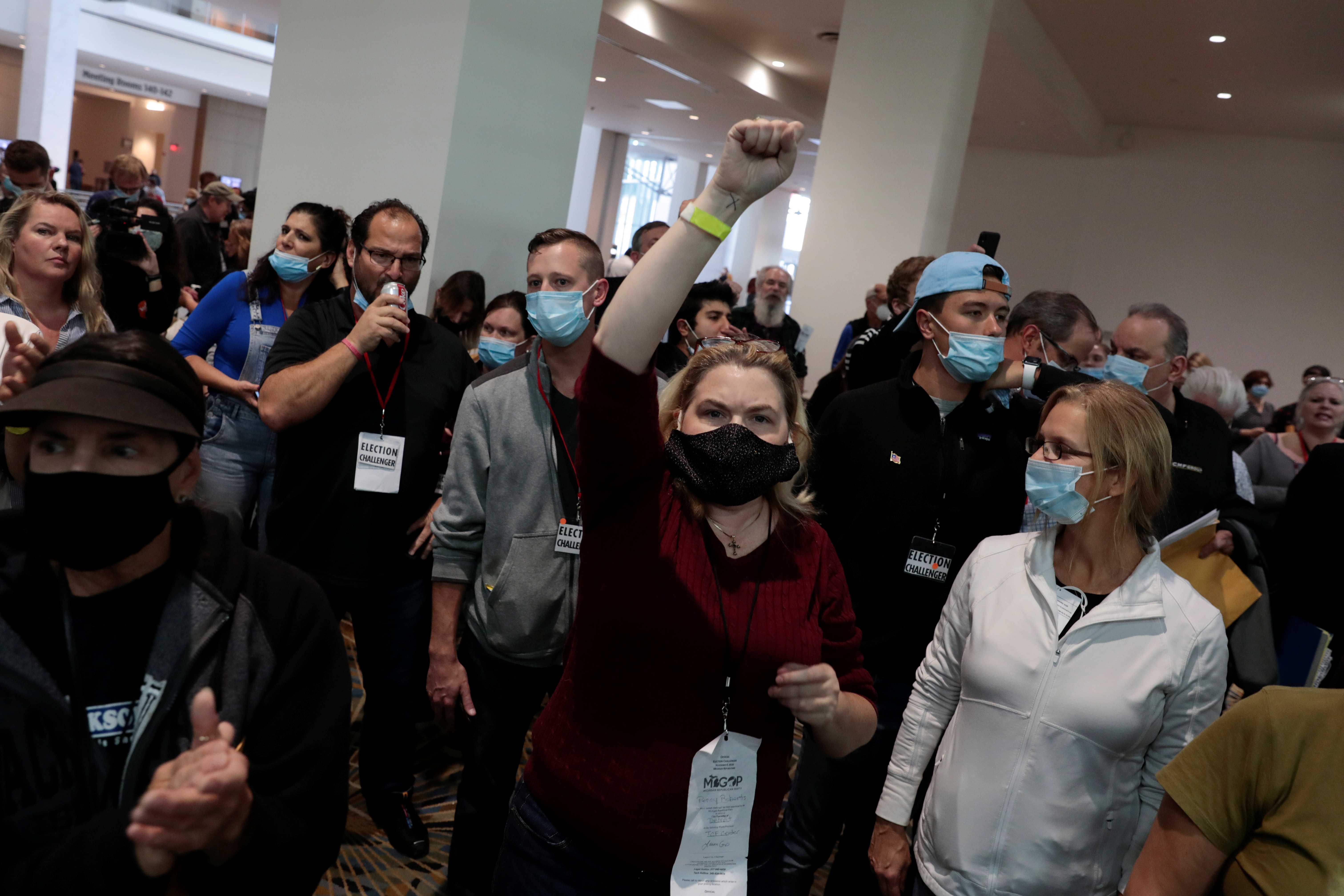 Trump-supporting poll challengers chant ‘stop the count’ outside the door of the ballot counting room after being asked to leave due to room capacity at the TCF Center after Election Day in Detroit, Michigan, on November 4