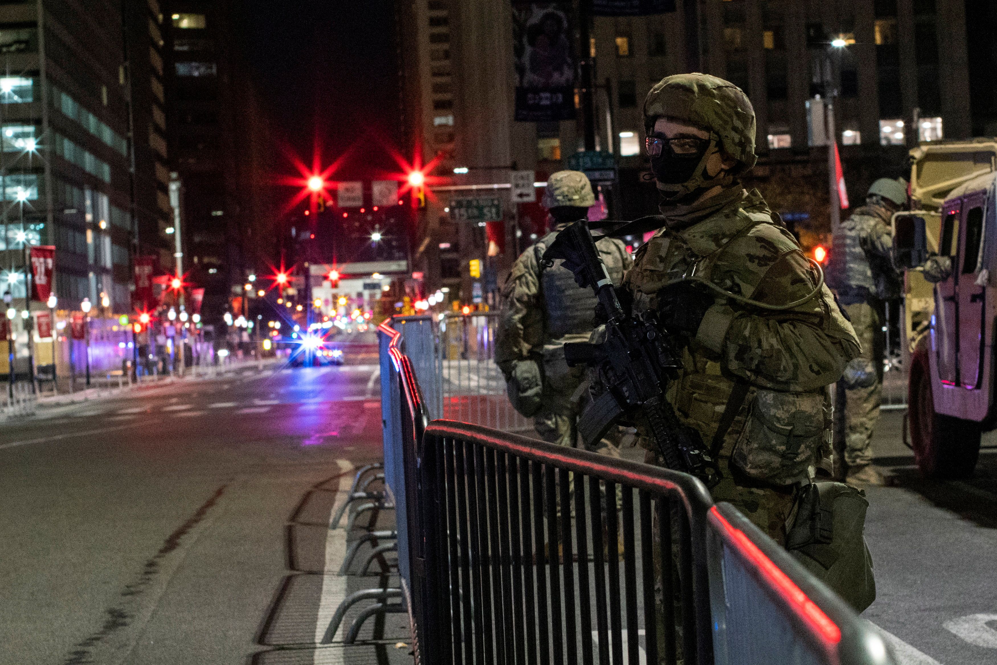 National Guard members stand guard near Philadelphia City Hall after police investigating an alleged plot to attack vote counting venue of the presidential election at the Pennsylvania Convention Center in Philadelphia, Pennsylvania