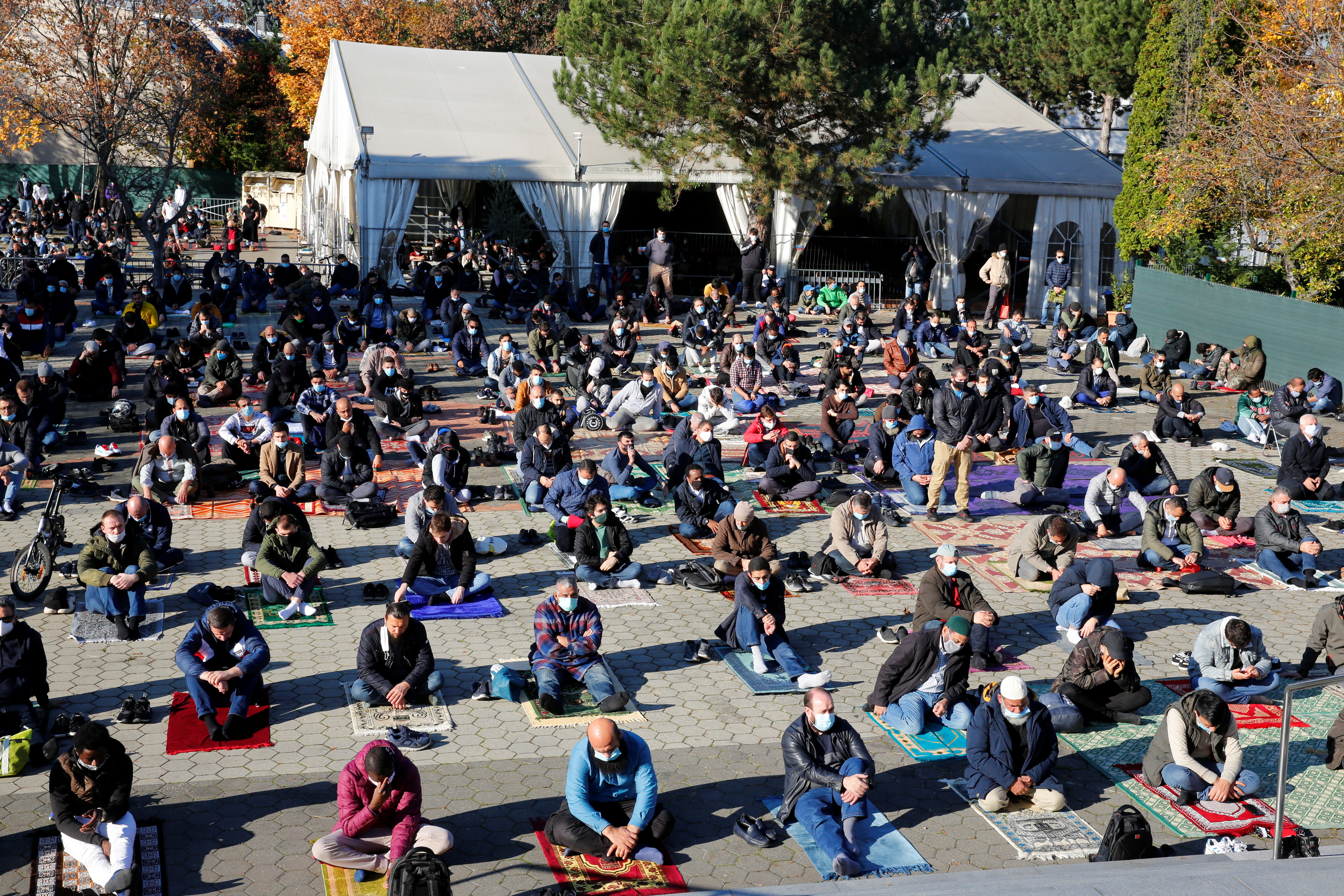 Muslims pray for victims of a gun attack during their Friday prayer at a mosque in Vienna, Austria [Leonhard Foeger/Reuters]