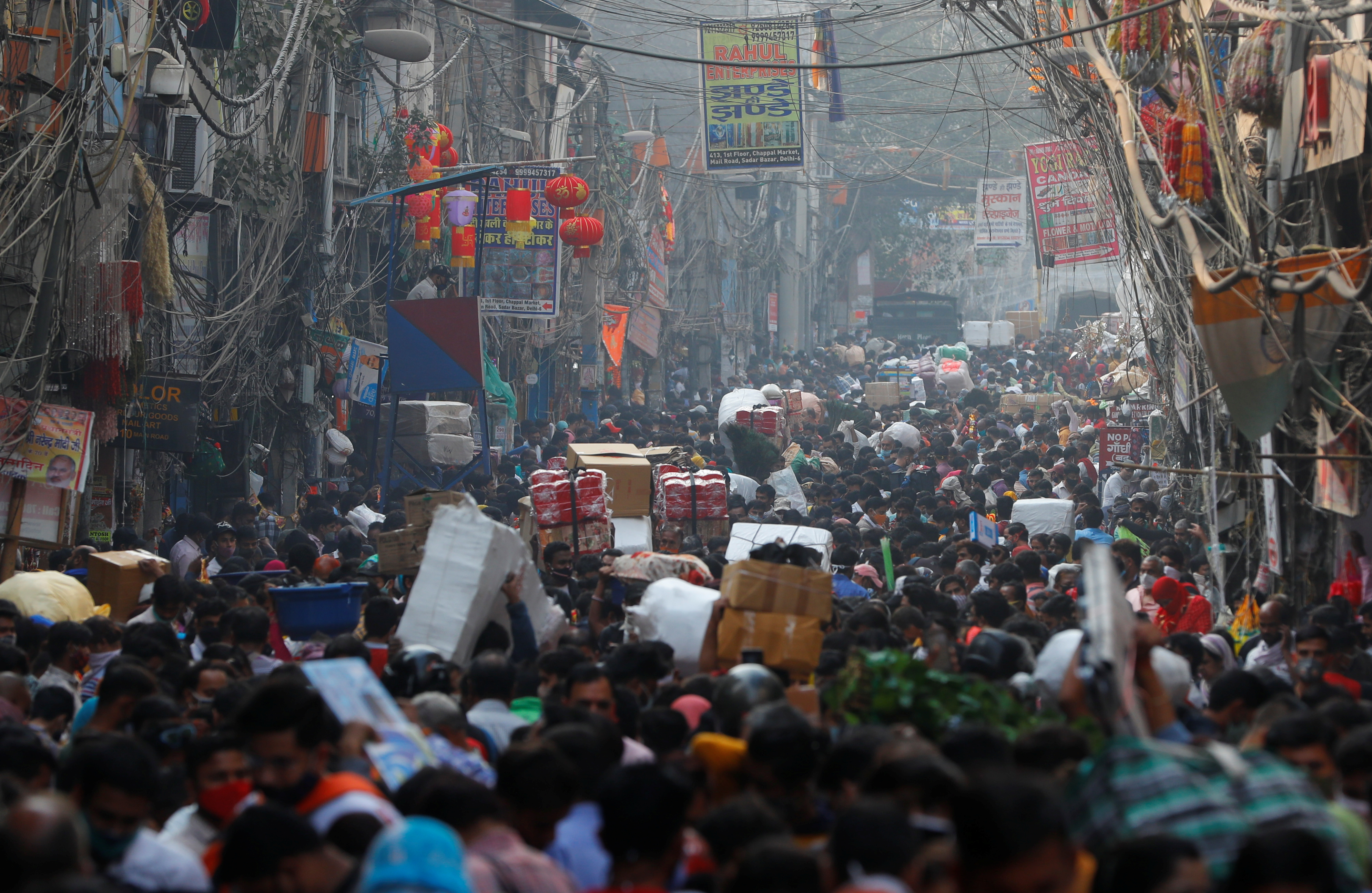 Shoppers crowd a market ahead of the Hindu festival of Diwali, amidst the spread of the coronavirus disease
