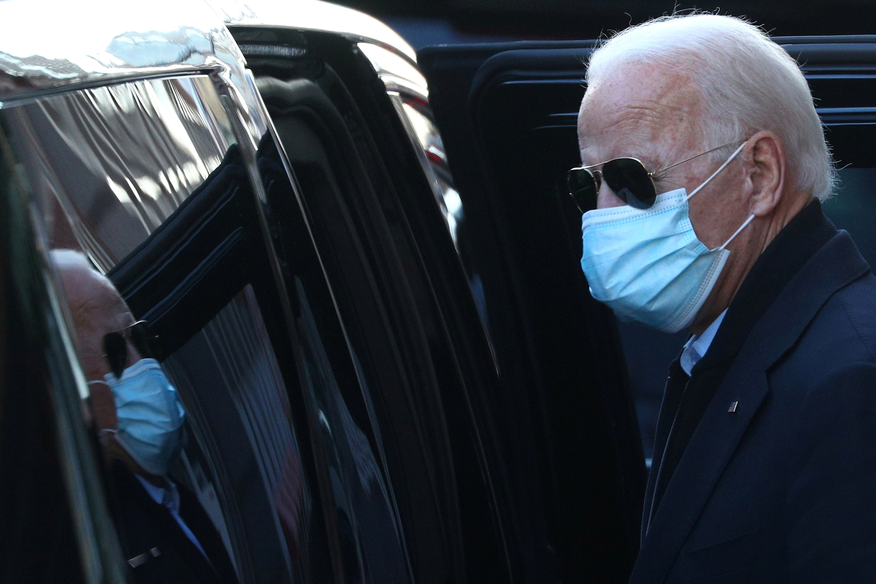 Biden exits The Queen theatre following a virtual meeting with front-line healthcare workers in Wilmington, Delaware. He faulted Trump for failing to allow an orderly transition