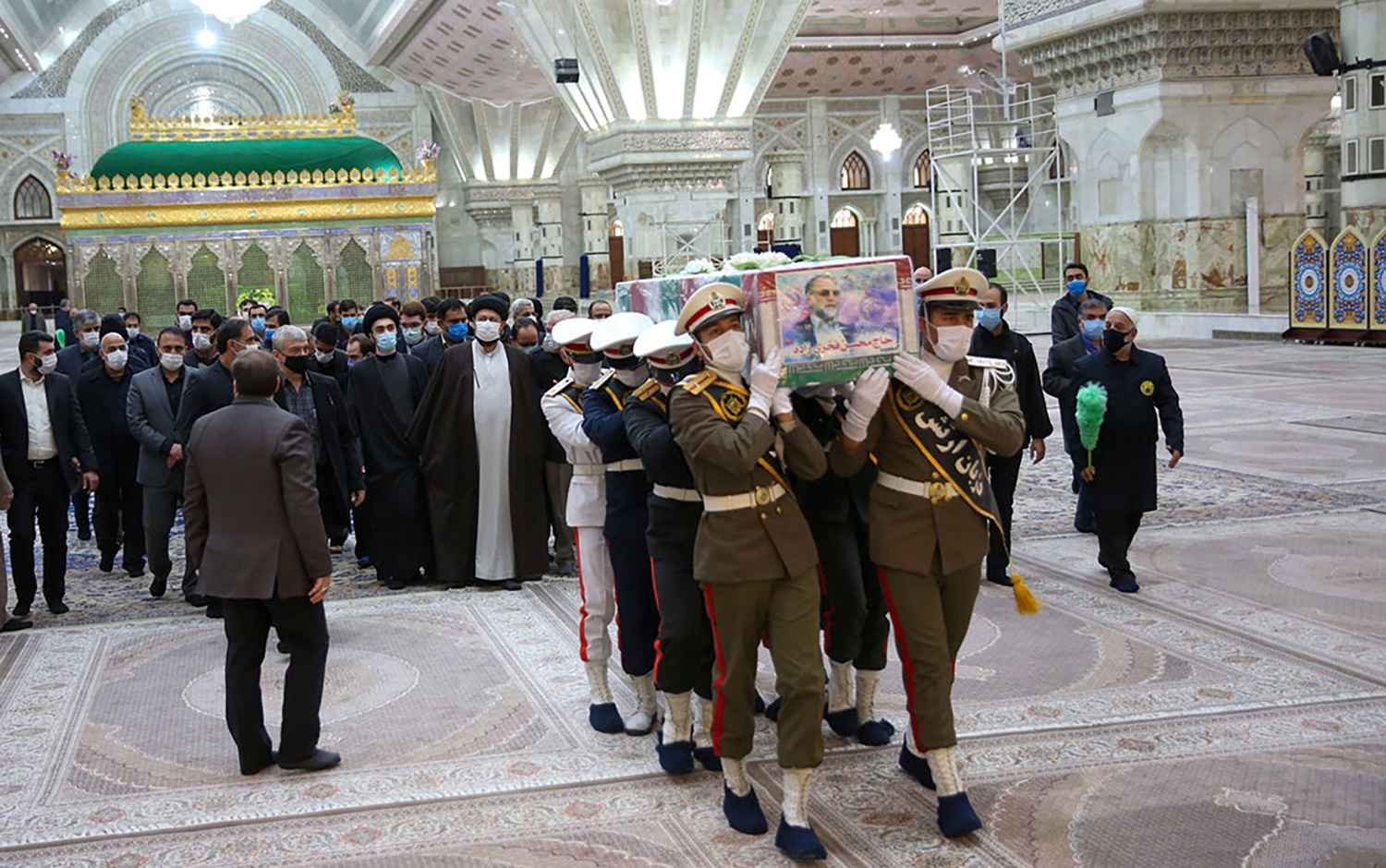 Members of Iranian forces carry Fakhrizadeh’s coffin at the Imam Khomeini’s shrine in Tehran