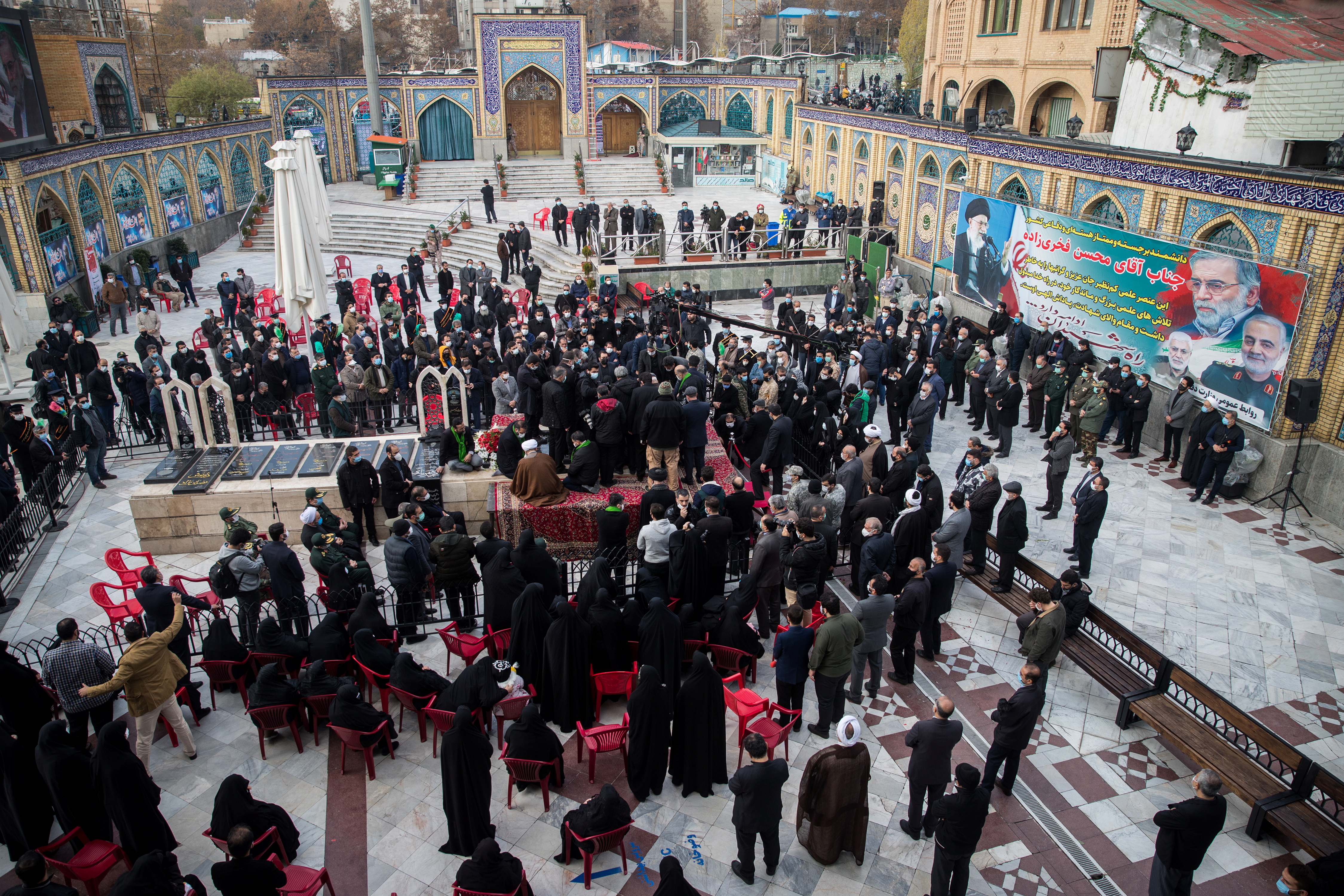 Mourners attend the burial ceremony of Fakhrizadeh at the shrine of Imamzadeh Saleh in Tehran