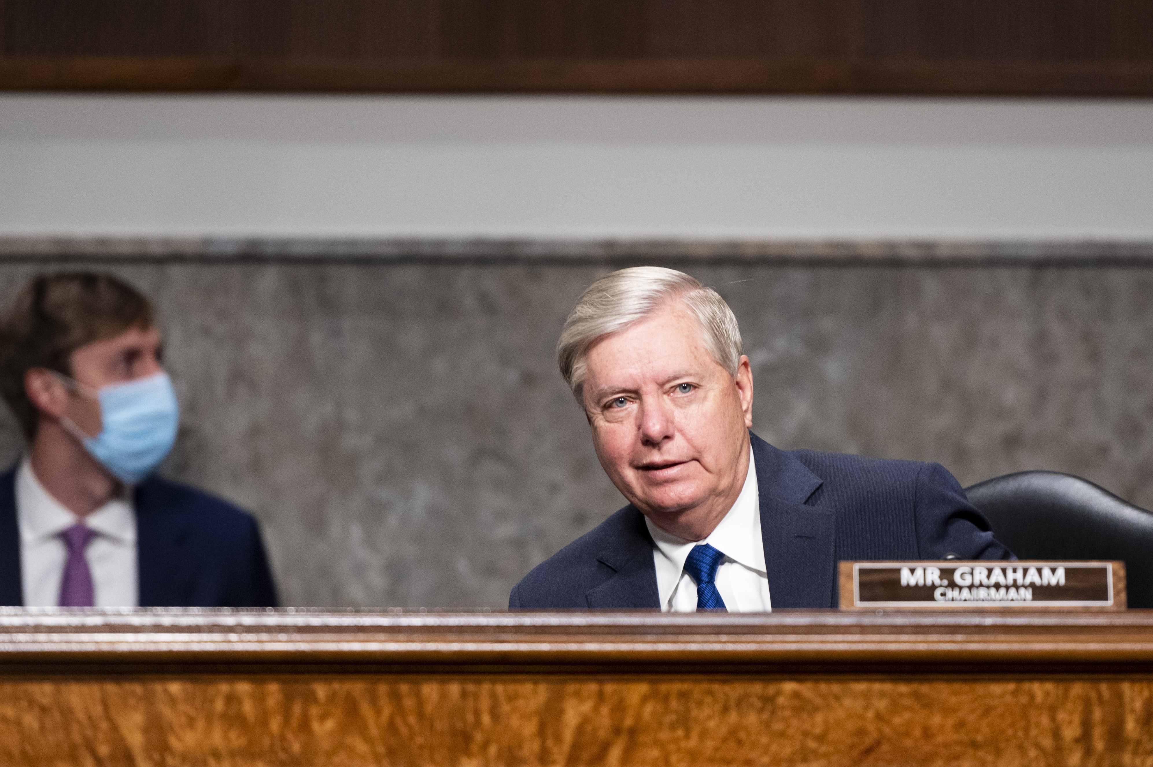Senator Lindsey Graham takes his seat before a Senate Judiciary Committee hearing on Facebook and Twitter’s actions around the closely contested election