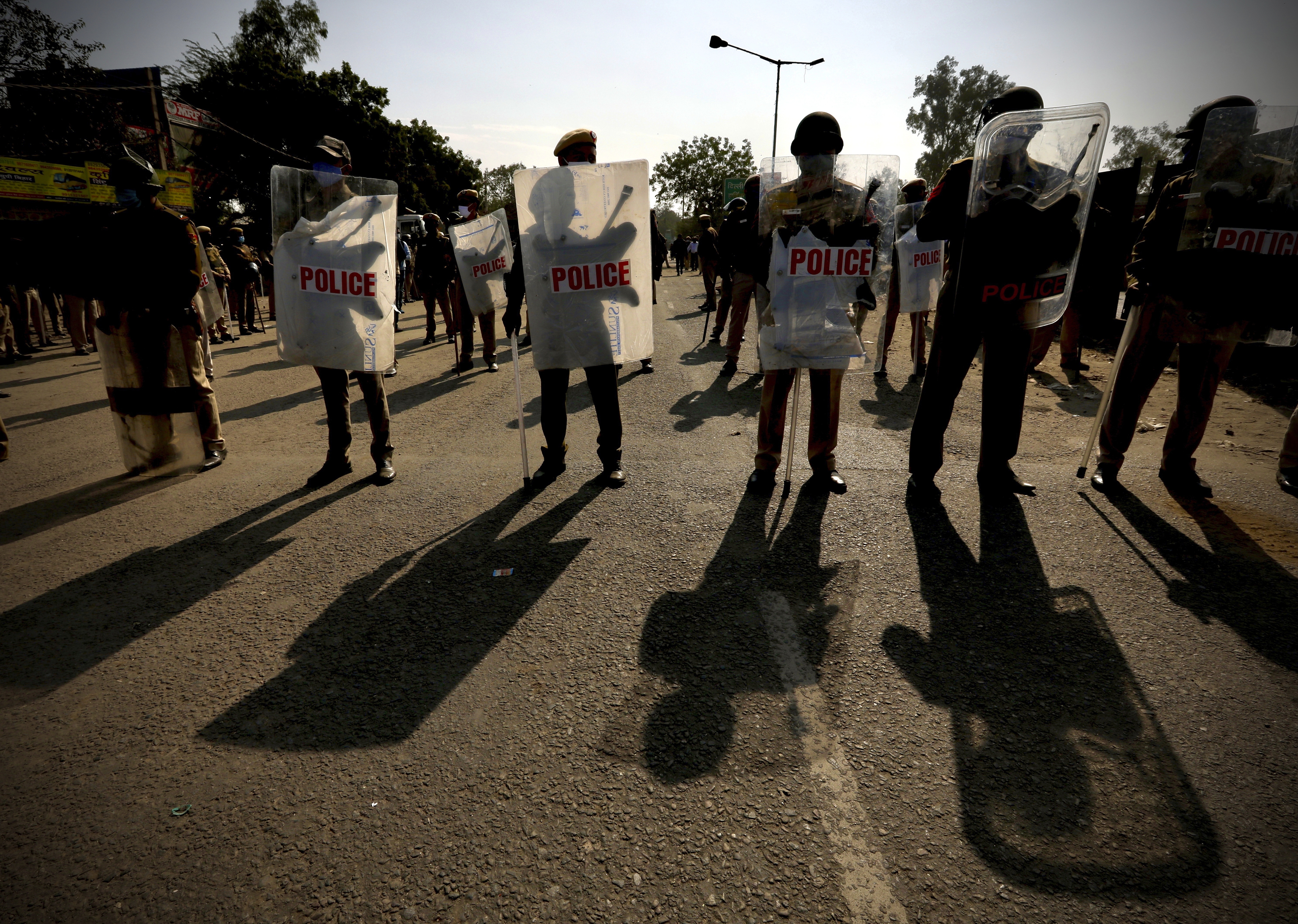 Policemen are deployed at the Haryana-New Delhi border to block protesting farmers from marching to the capital in New Delhi