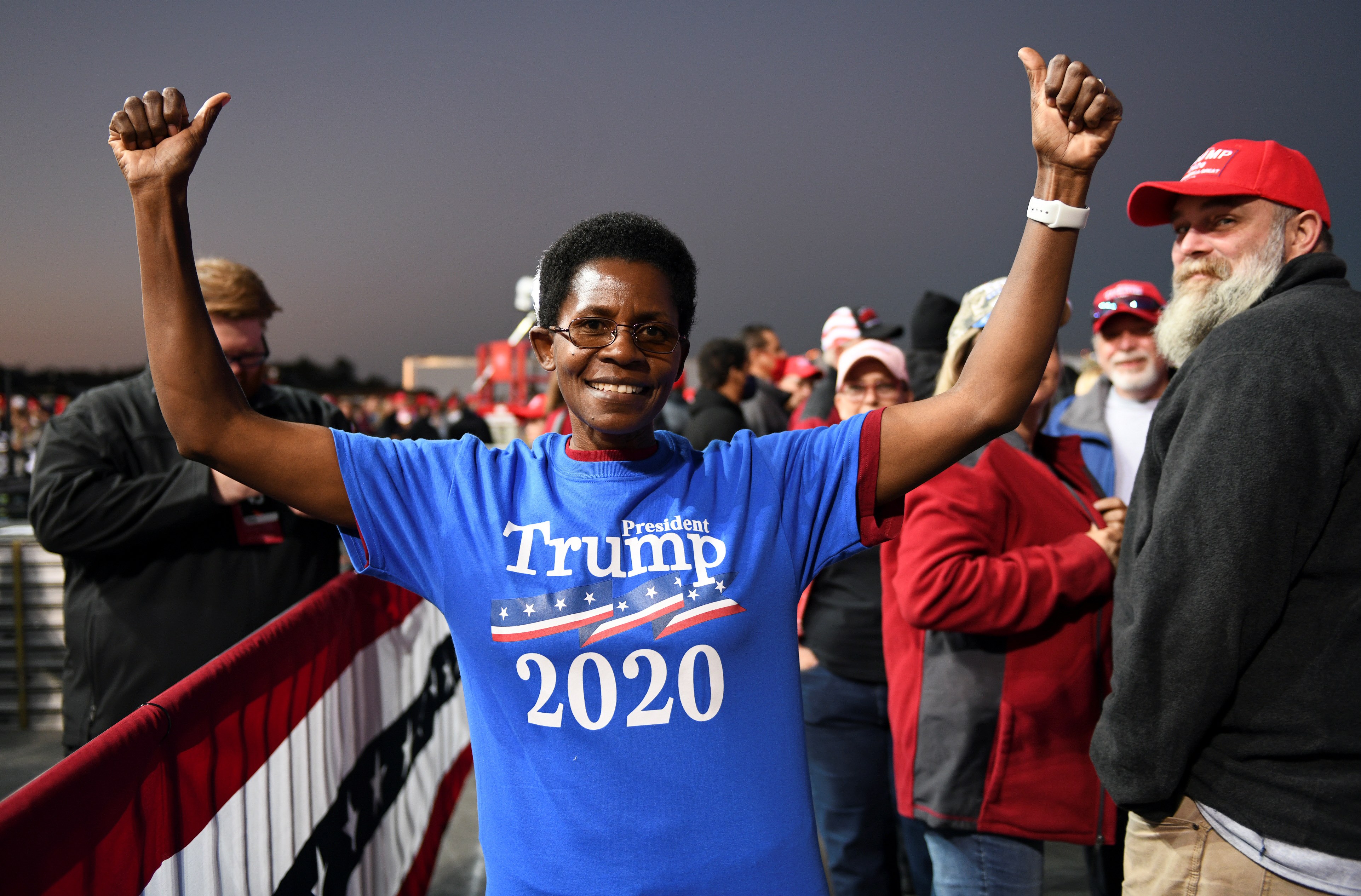 A supporter poses for a picture during a campaign rally by US President Donald Trump in Rome, Georgia, the United States