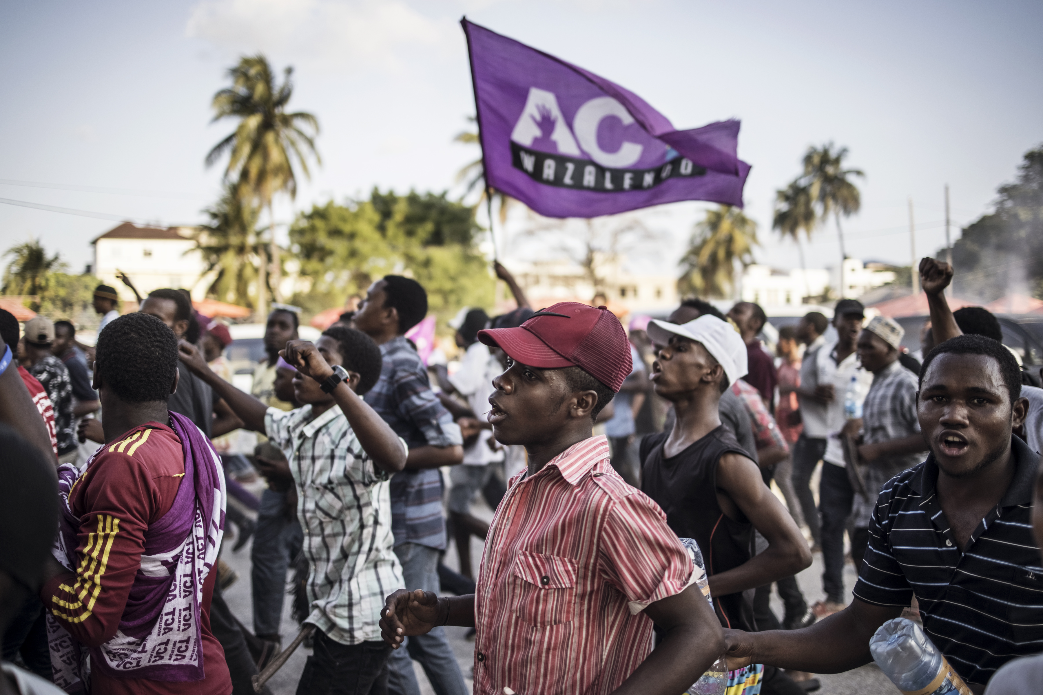Opposition supporters demonstrate at the end of the last campaign rally in Stone Town before the national elections