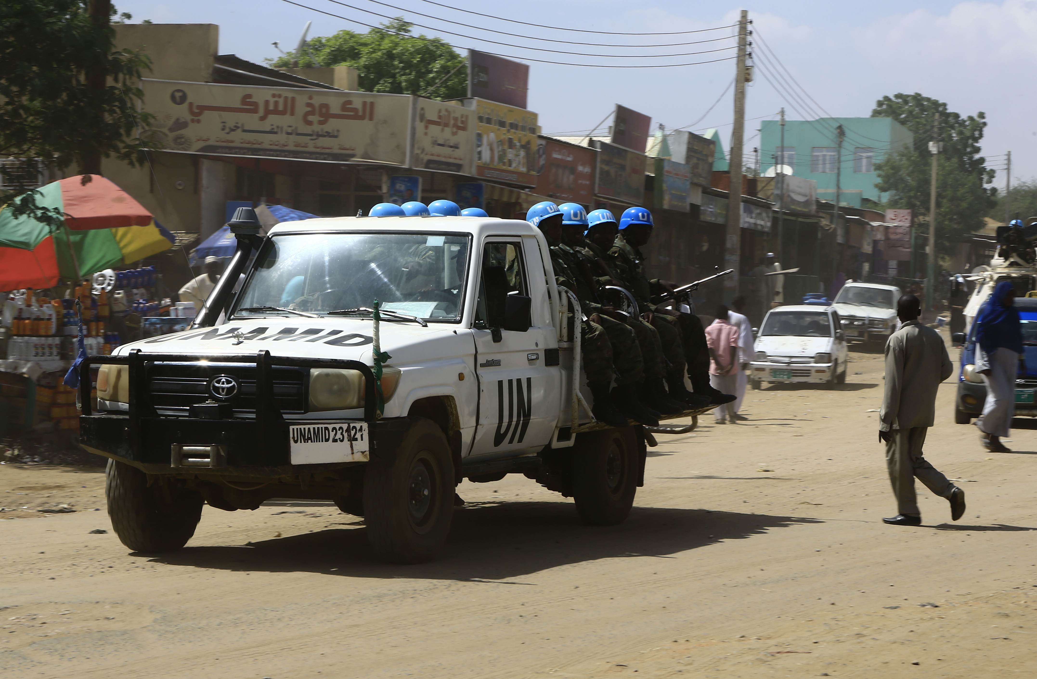 United Nations peace-keepers sit in the back of a vehicle in North Darfur’s state capital El Fasher on September 5, 2016