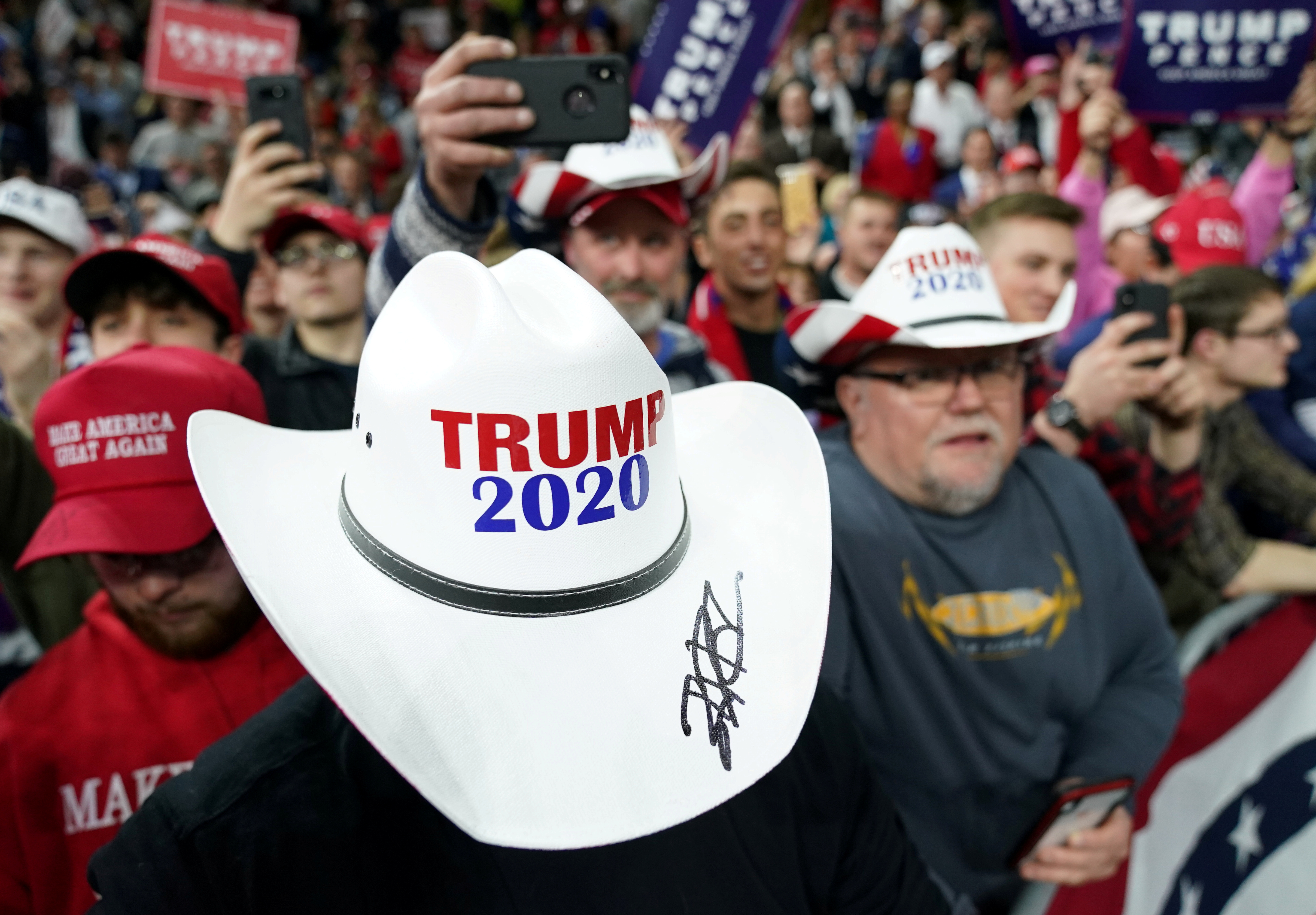 A supporter wears a “Trump 2020” hat as US President Donald Trump holds a campaign rally in Milwaukee, Wisconsin, January 14, 2020