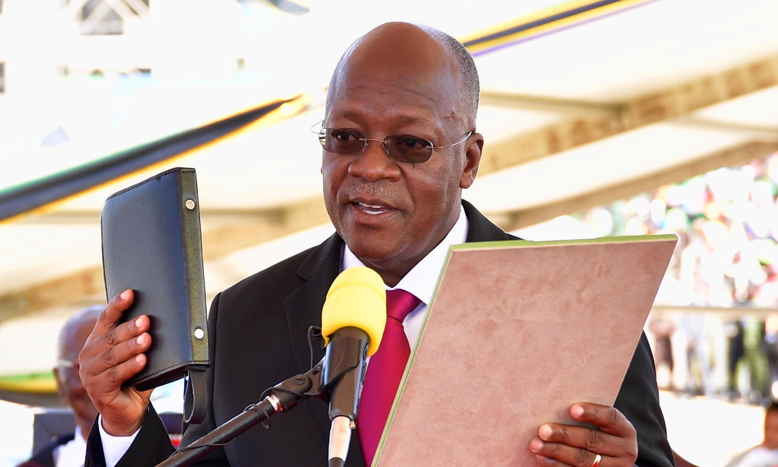 Tanzania's re-elected President John Pombe Magufuli takes the oath of office during his swearing-in ceremony for the second term at the Jamhuri Stadium in Dodoma, Tanzania on November 5, 2020 [Reuters/Handout]
