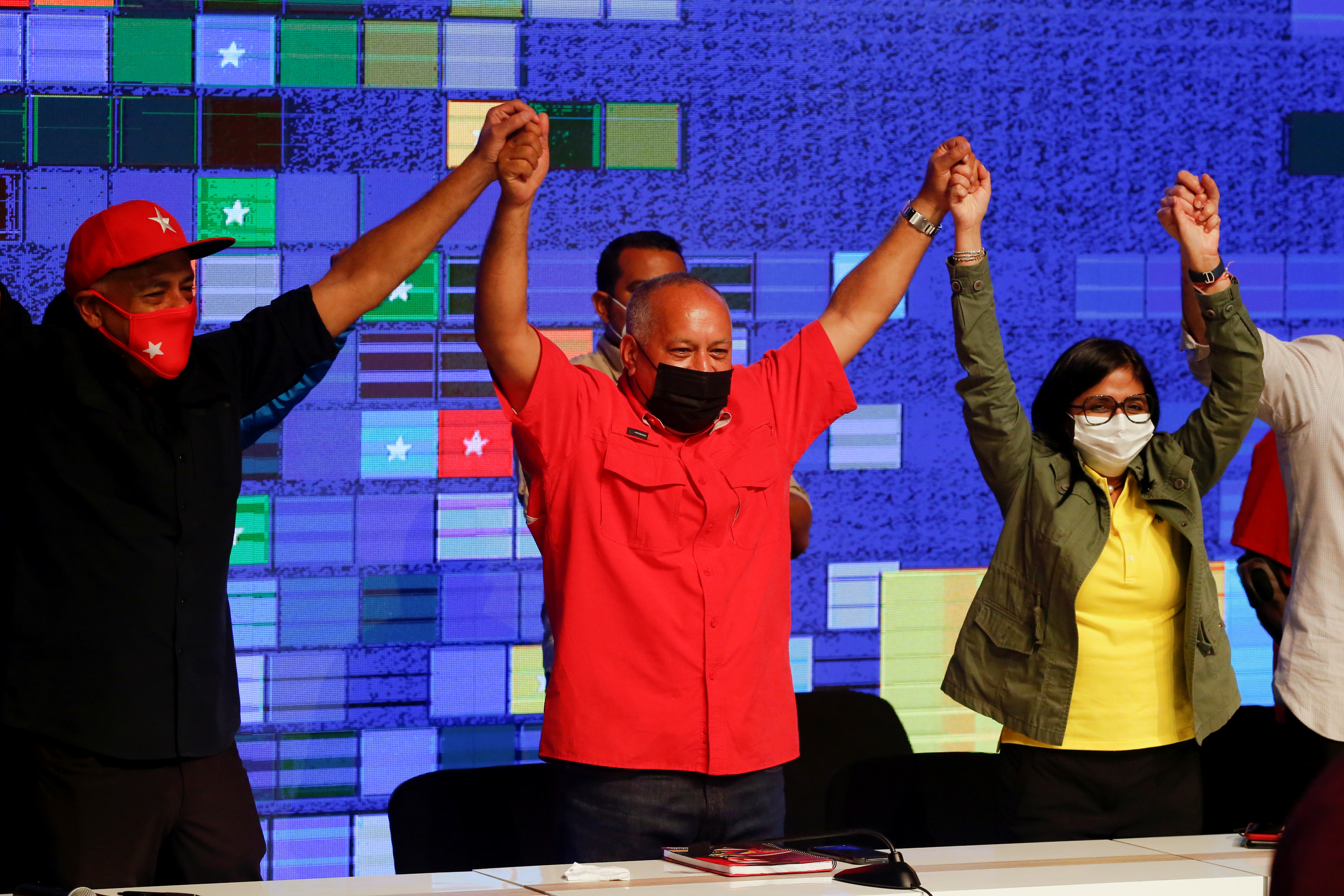 Parliamentary candidate Jorge Rodriguez, Venezuela’s National Constituent Assembly President Diosdado Cabello and Venezuela’s Vice President Delcy Rodriguez celebrate after the announcement of the results of the parliamentary election in Caracas, Venezuela