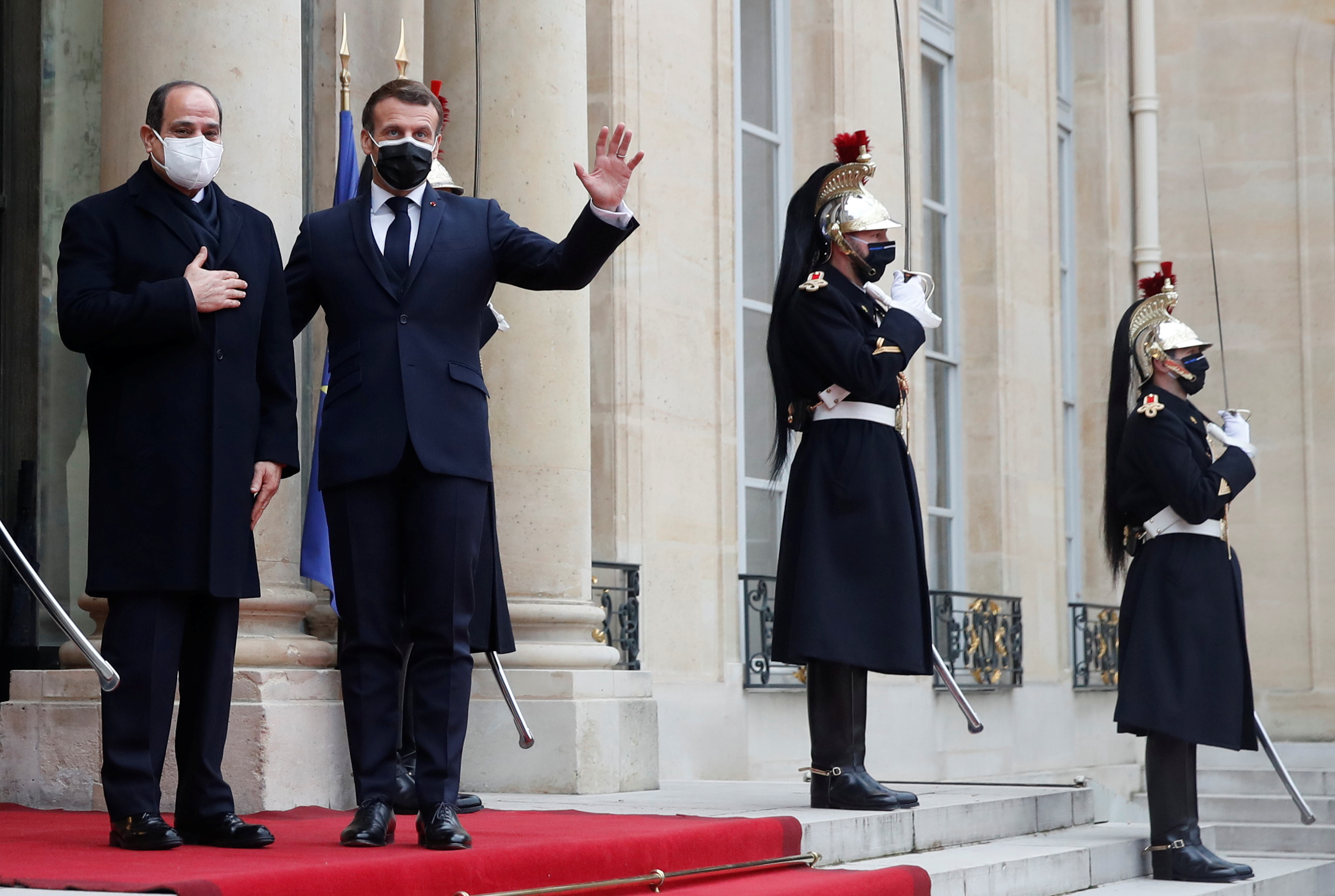 French President Emmanuel Macron welcomes his Egyptian counterpart Abdel Fattah el-Sisi at the Elysee Palace in Paris during his official visit to France