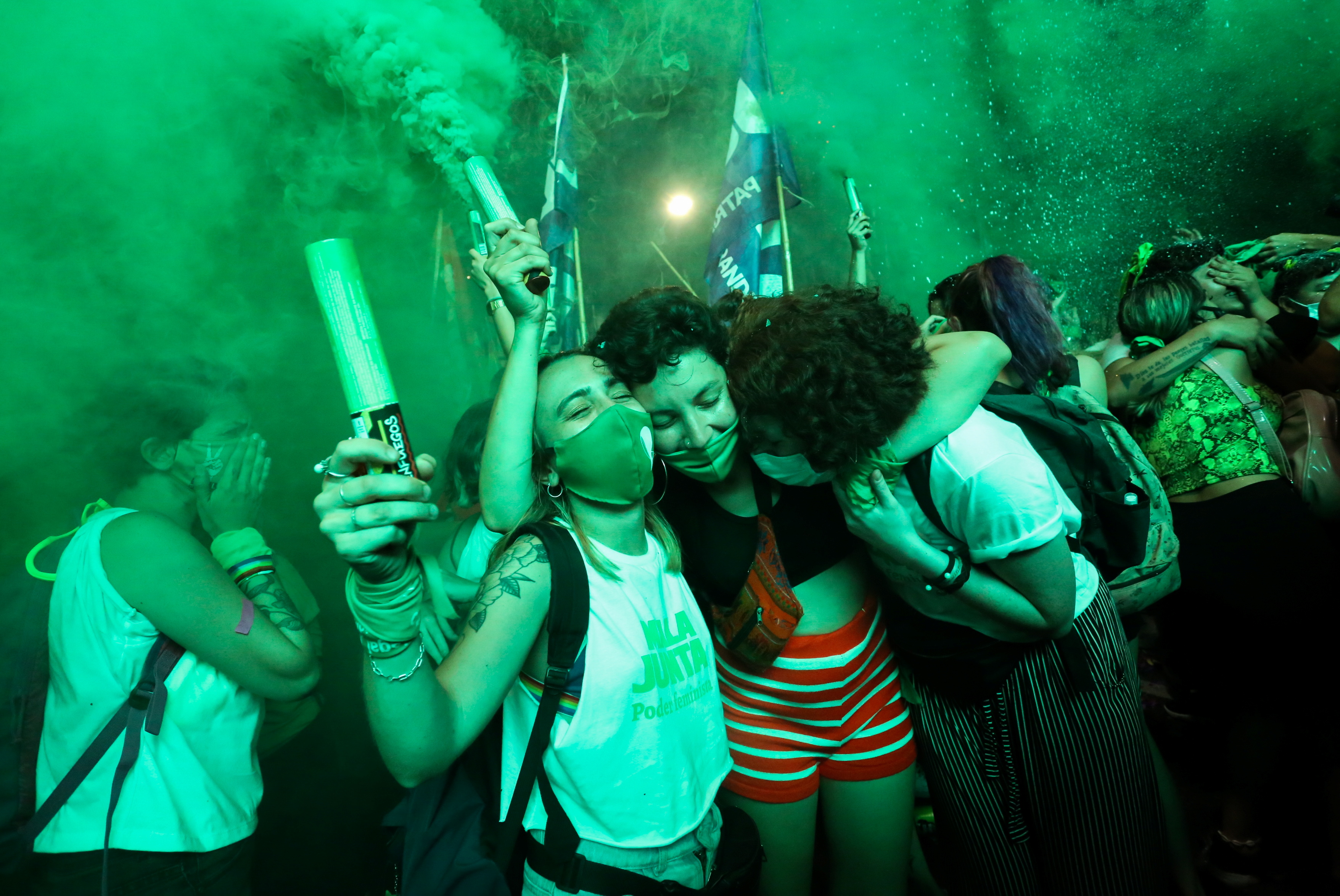 Demonstrators in favour of legalising abortion react after the senate passed an abortion bill, in Buenos Aires, Argentina